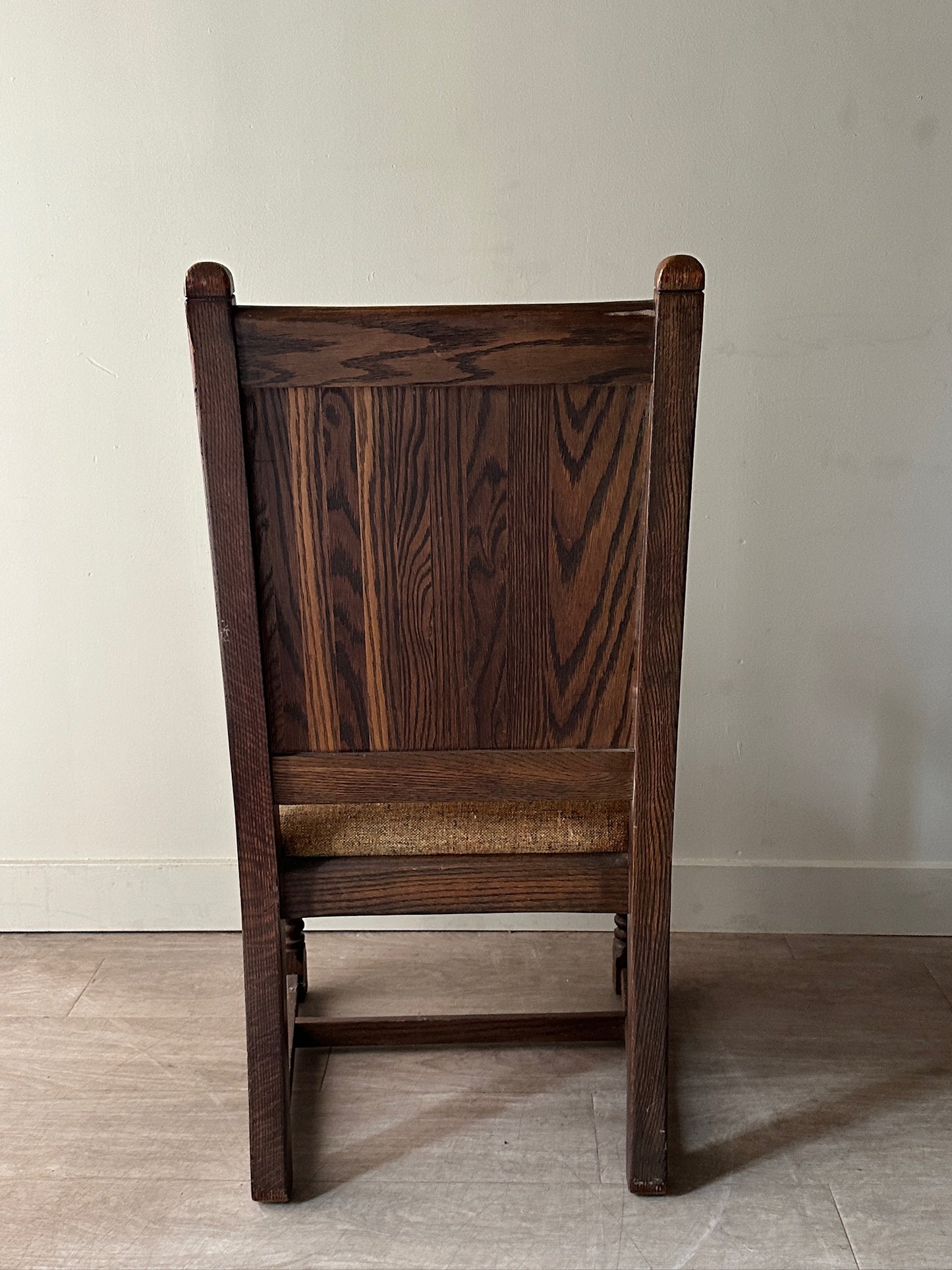 Carved oak upholstered armchair