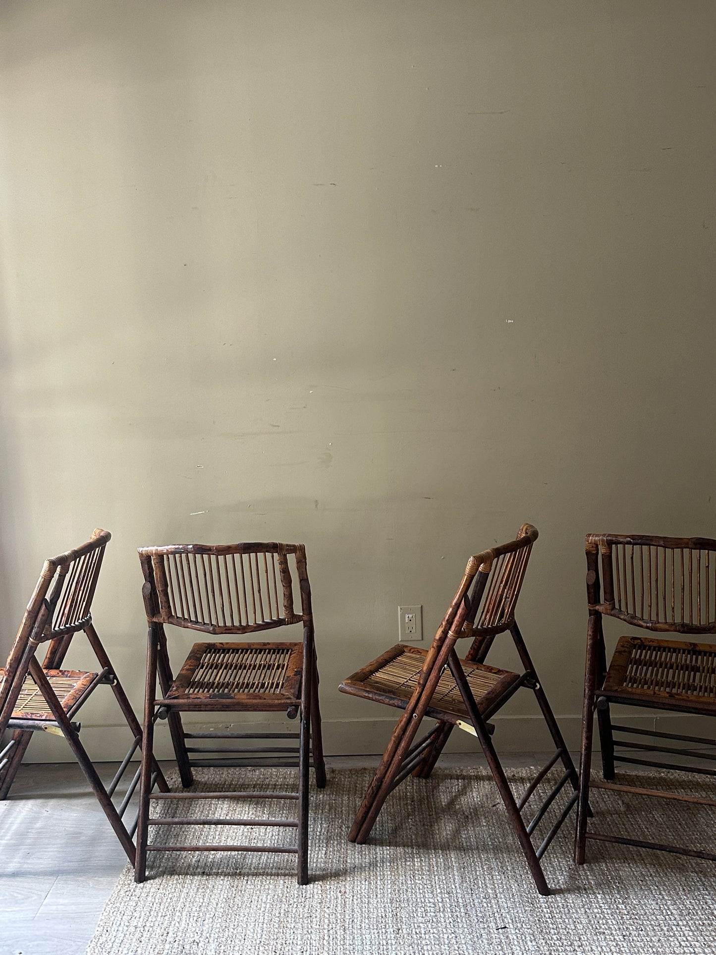 Scorched bamboo folding chairs. Sold in pairs.