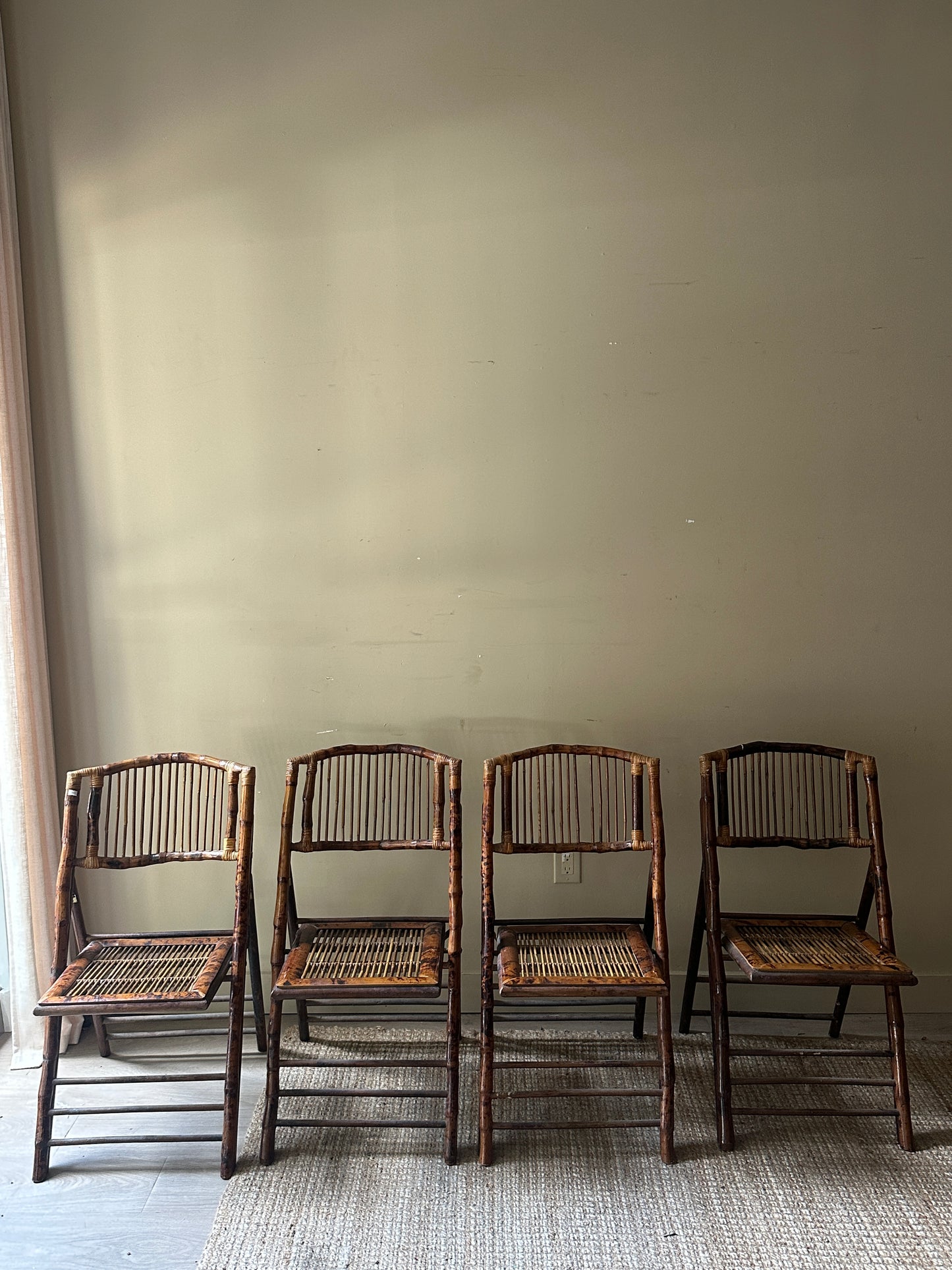 Scorched bamboo folding chairs. Sold in pairs.