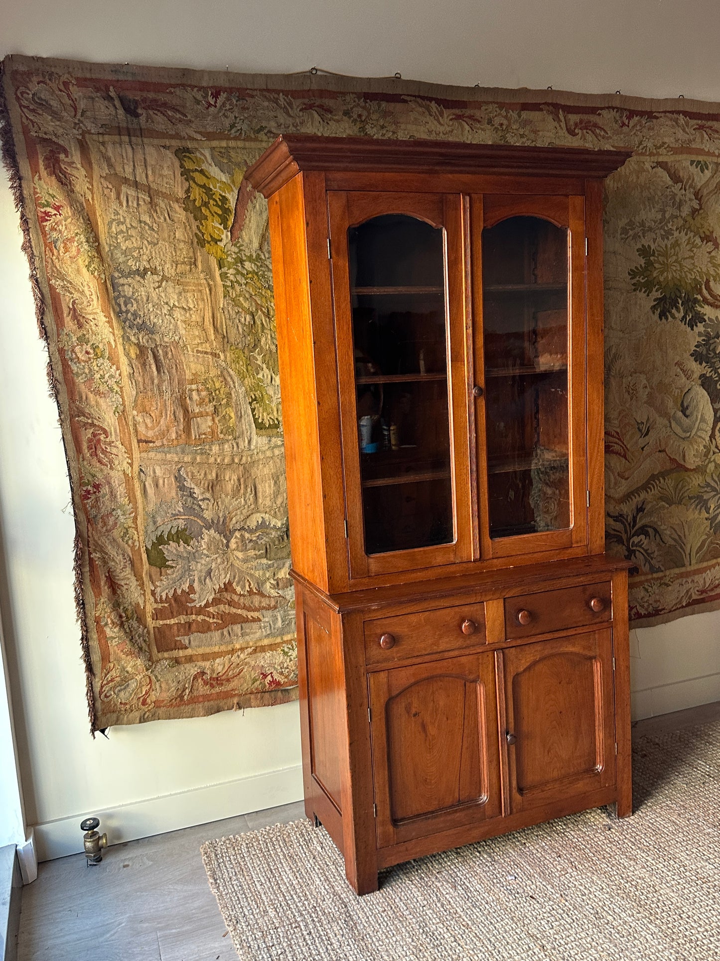 Two piece walnut step back cupboard