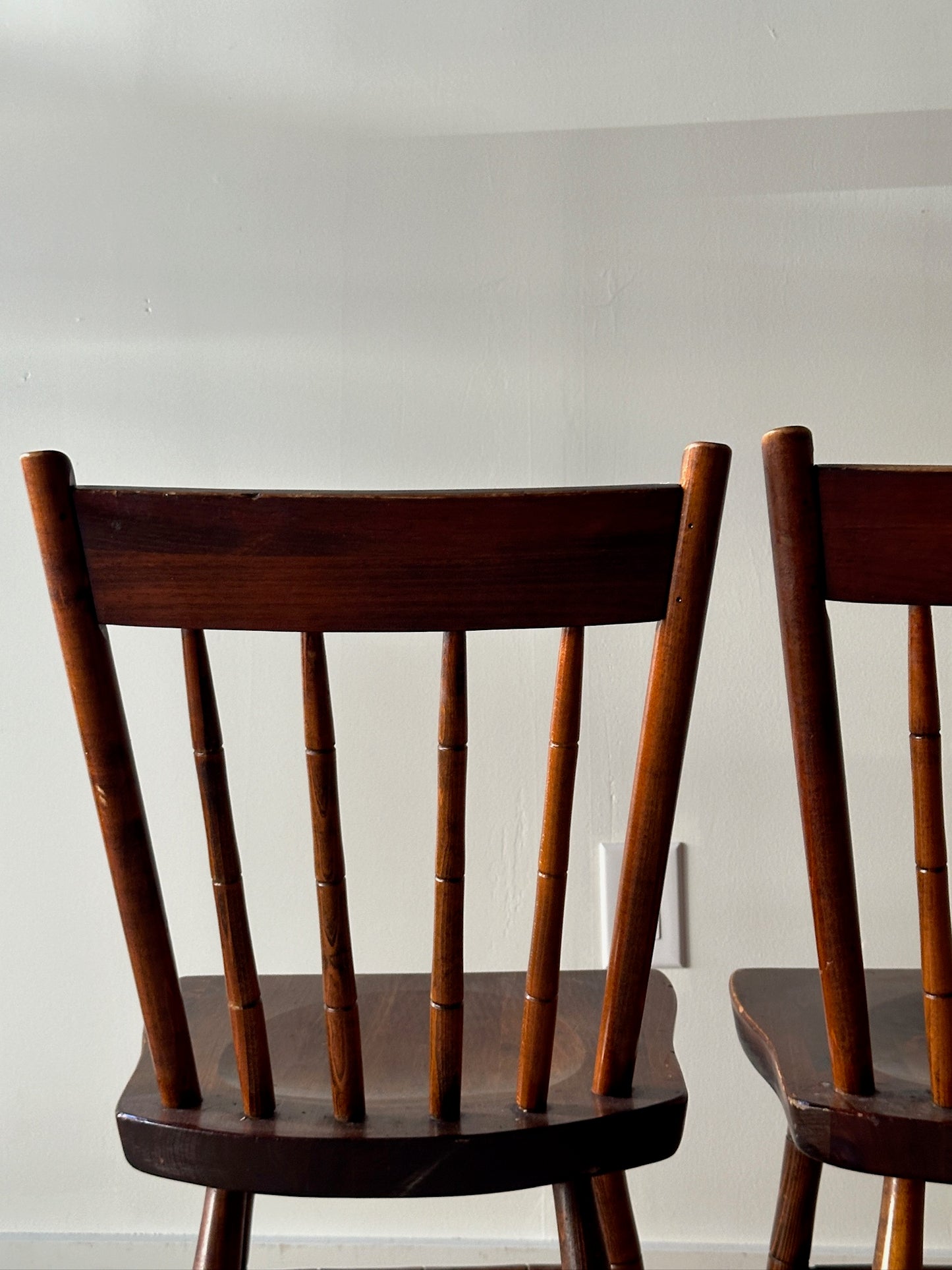 Pair of carved plank seat chairs