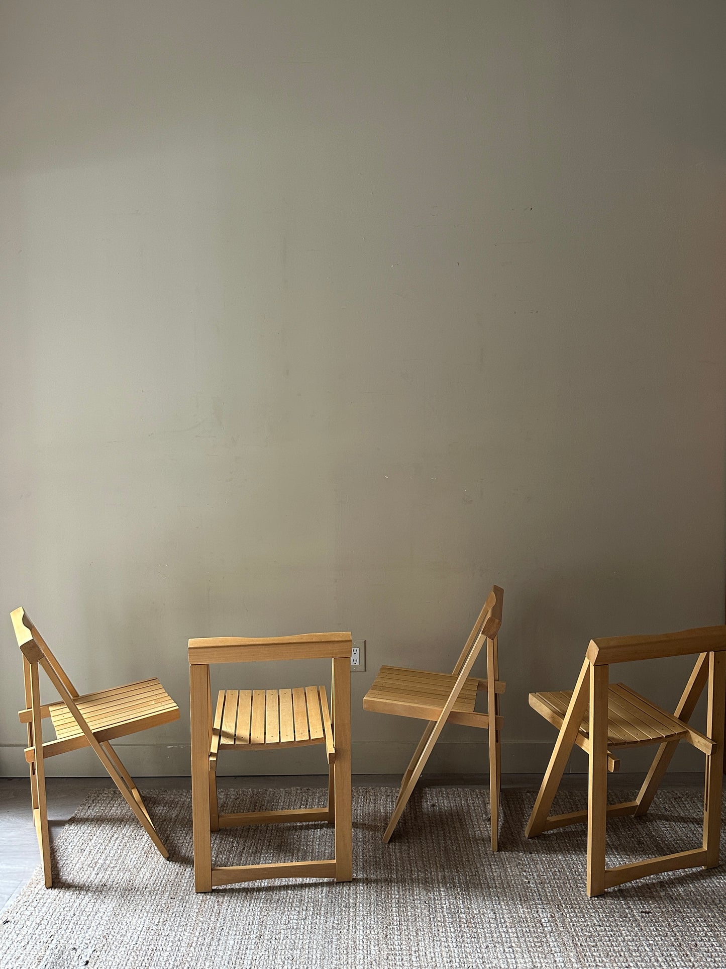 Oak folding chairs. Sold in pairs.