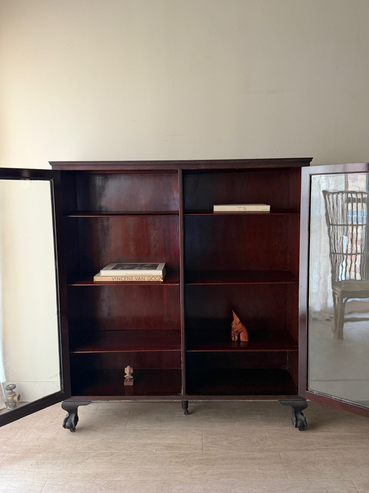 Mahogany claw foot display cabinet