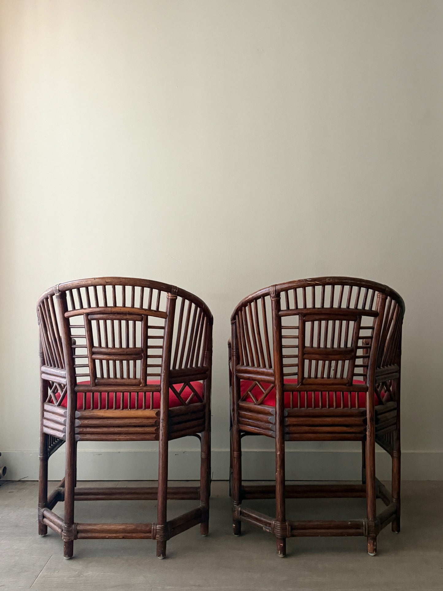 Rattan armchairs. Sold individually.