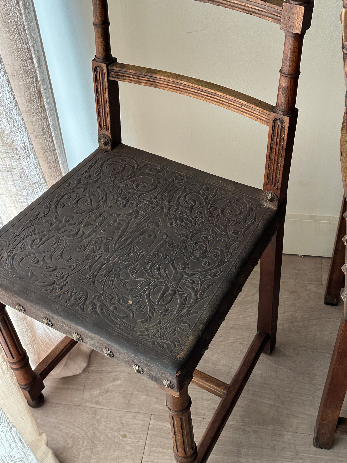 Embossed leather chairs. Sets of 2.