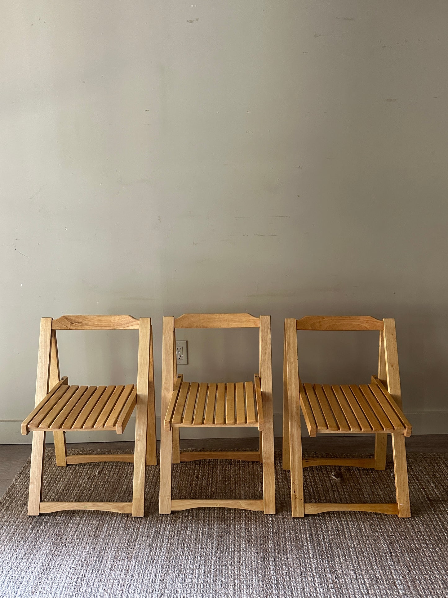 Oak folding chairs. Sold individually.