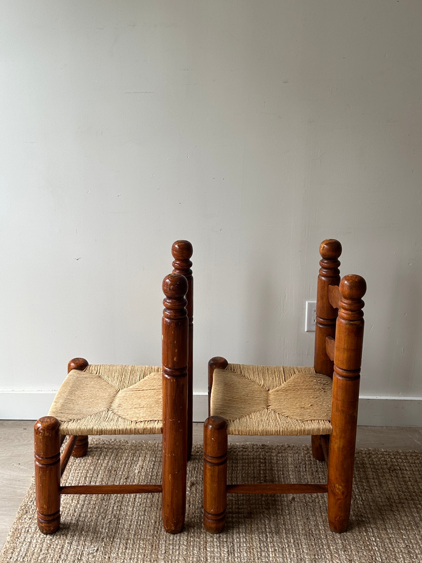 Ladder back rush seat chairs. Sold individually.