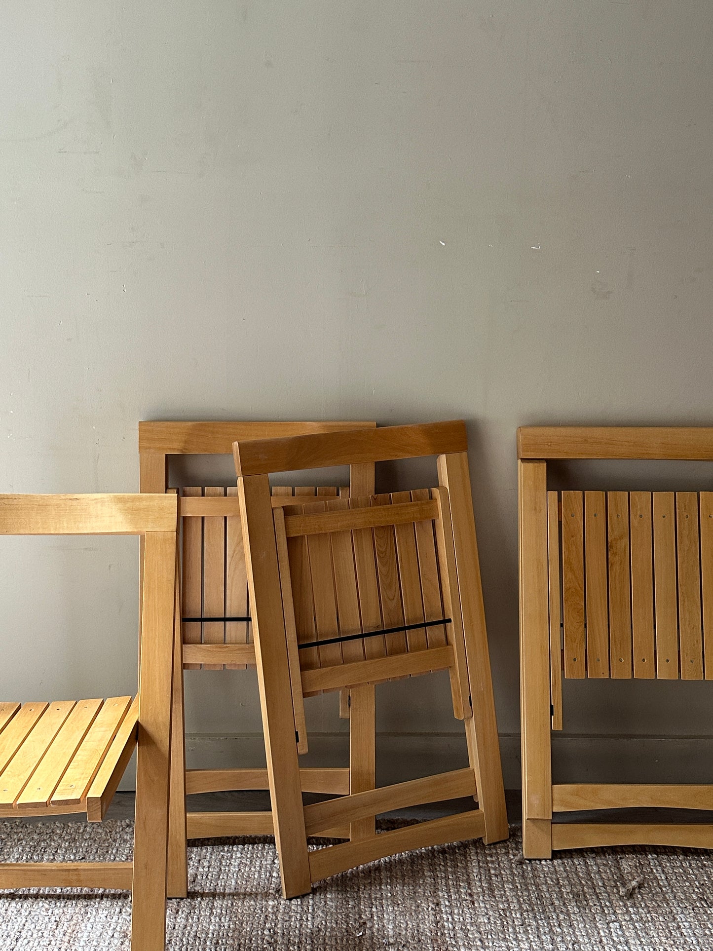 Oak folding chairs. Sold in pairs.