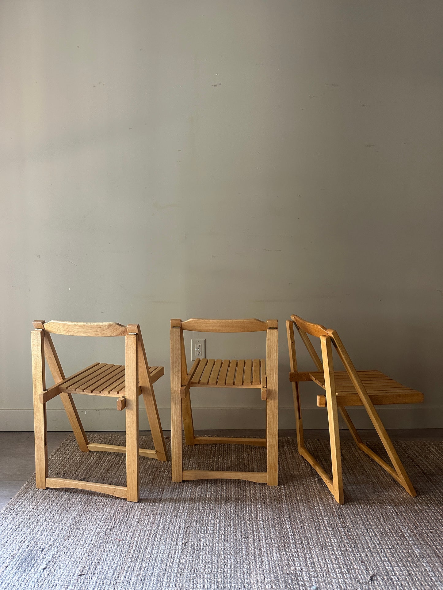 Oak folding chairs. Sold individually.
