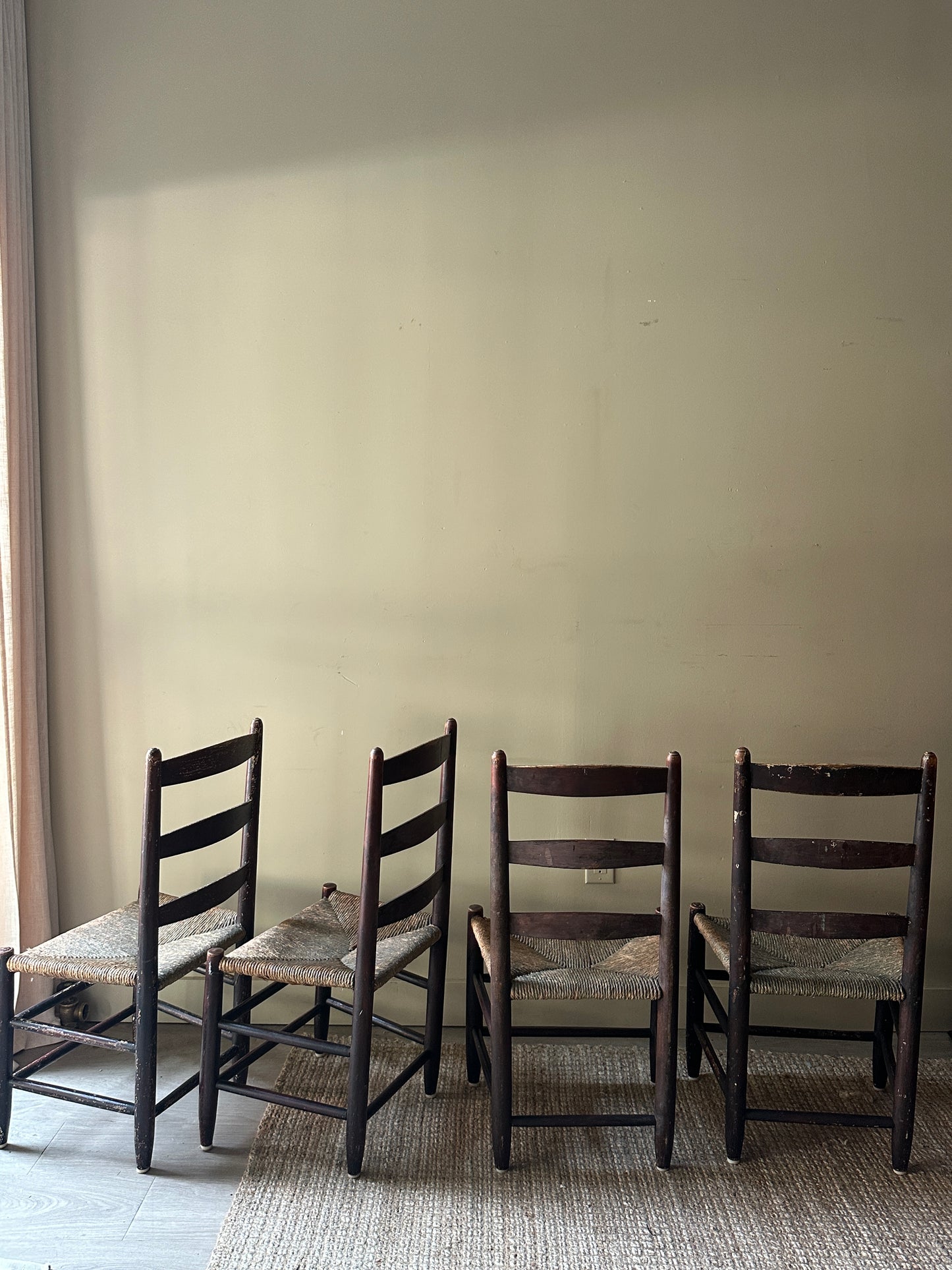 Ladder back rush seat chairs. Sold in pairs.
