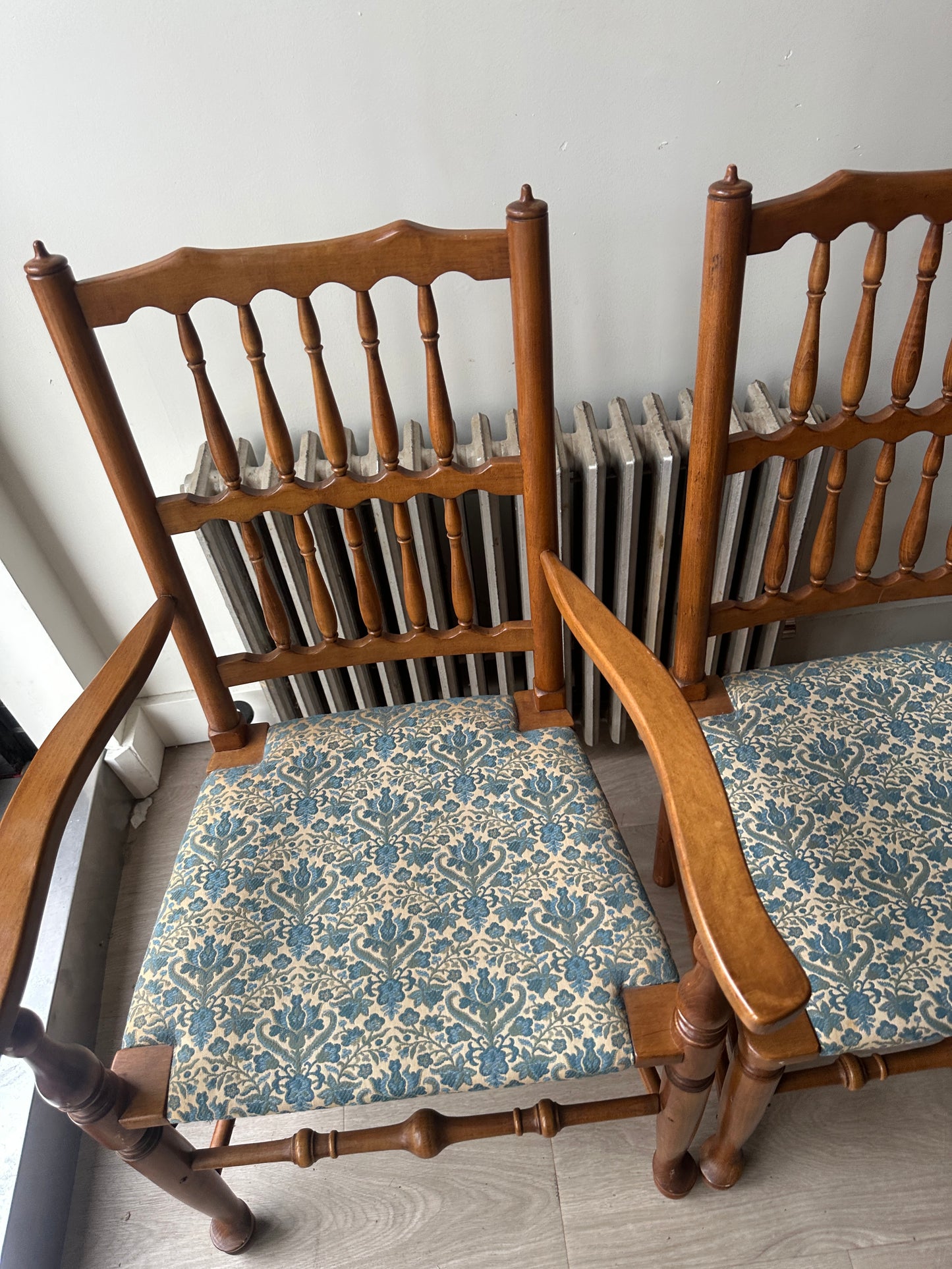 2 Stickley dining chairs with arms. Sold individually.