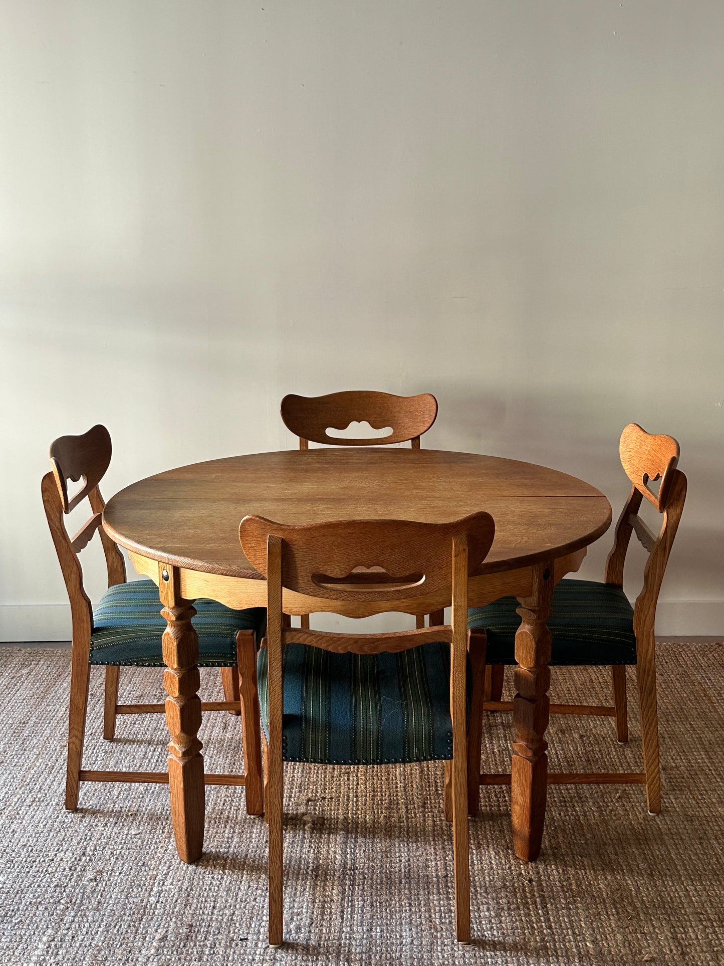 Carved block leg dining table with leaf