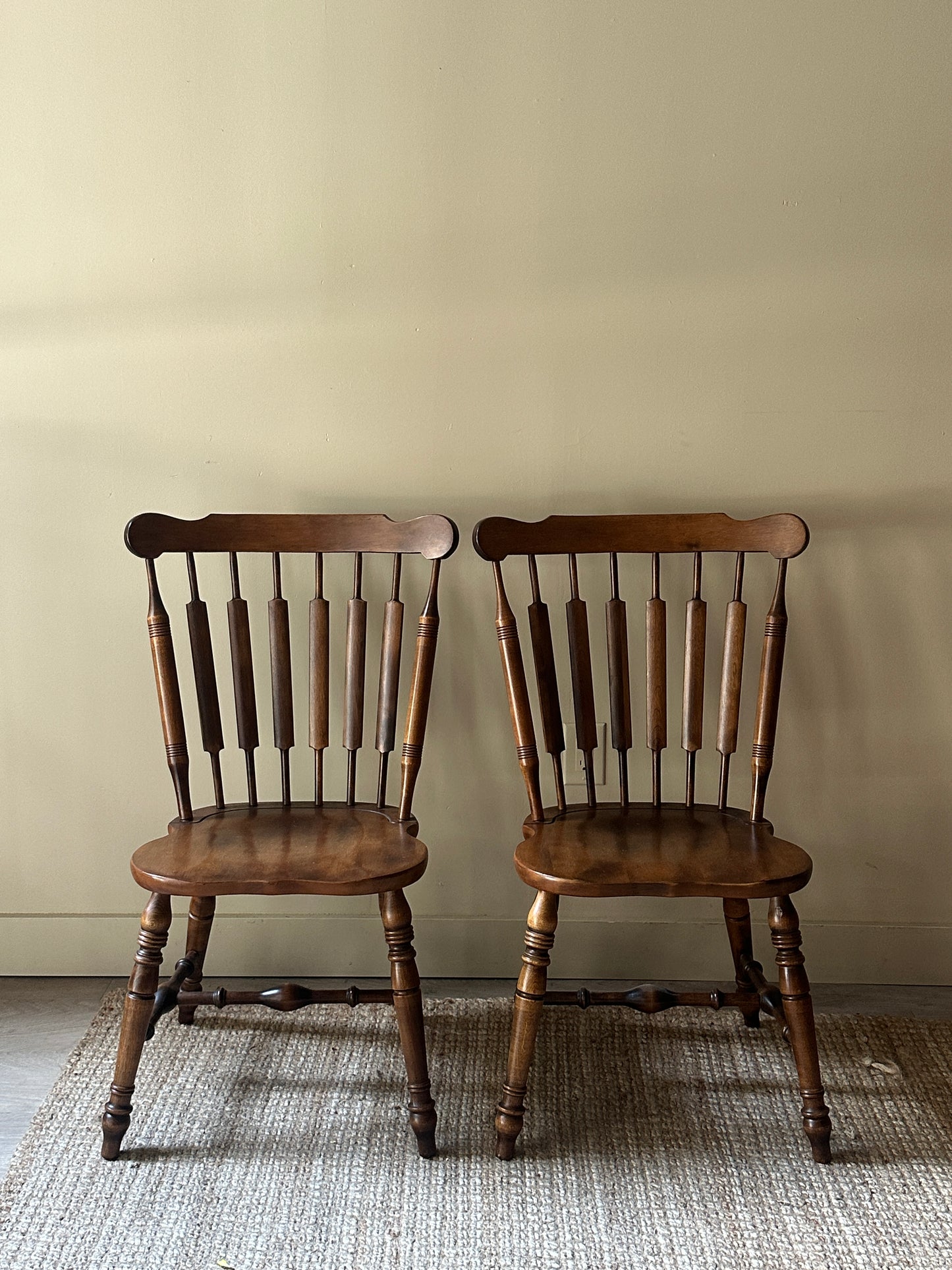 Windsor walnut chairs. Sold in pair.