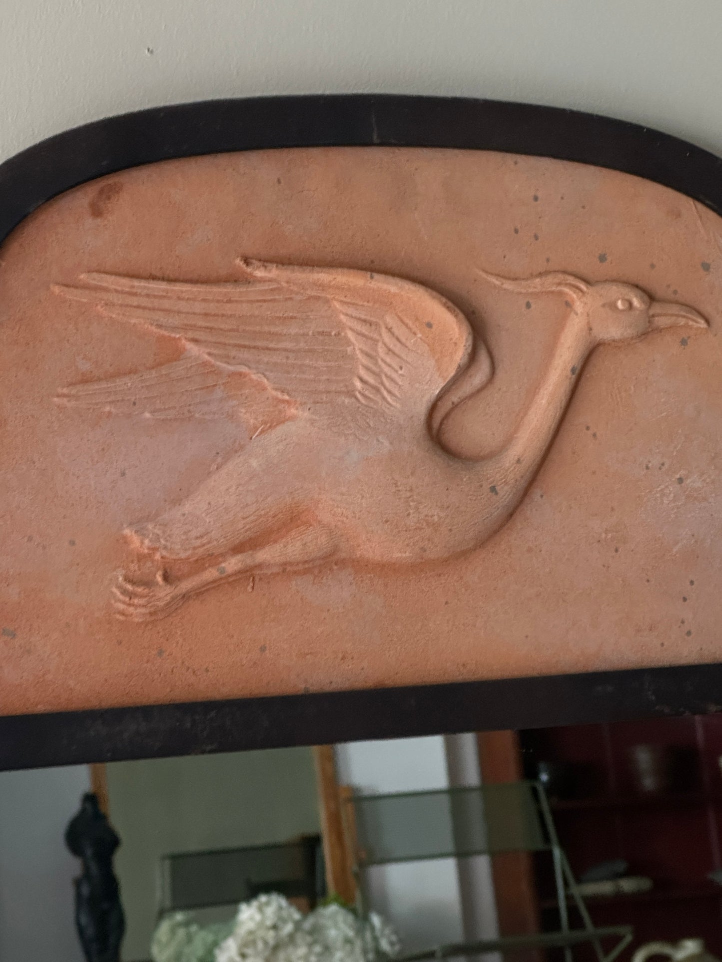 Metal and terracotta heron mirror