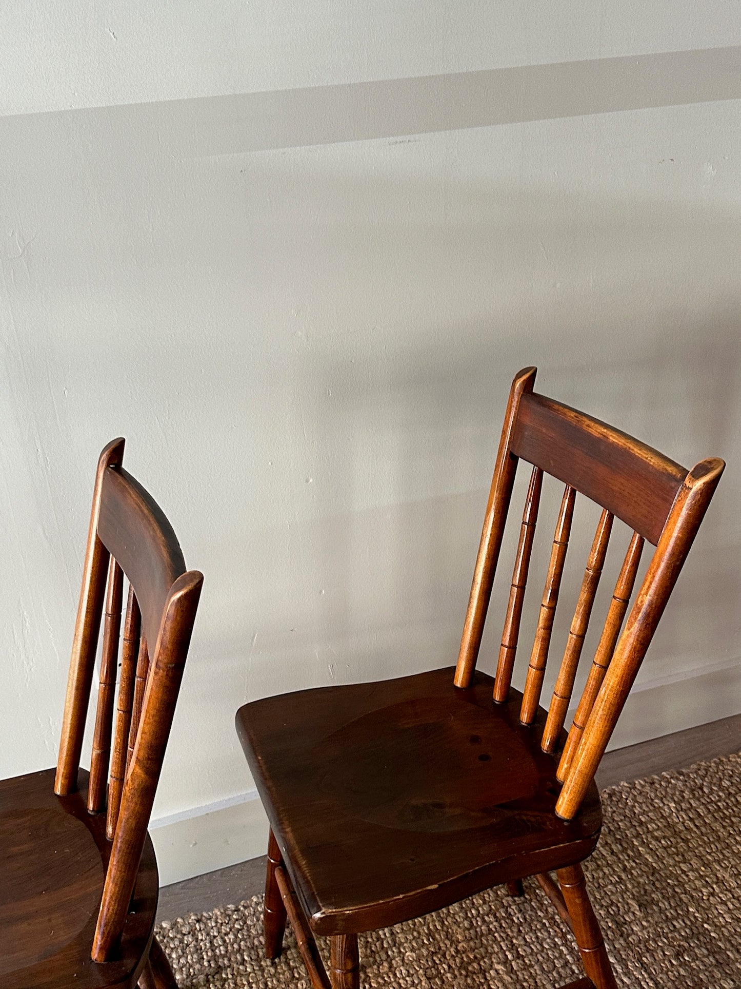 Pair of carved plank seat chairs