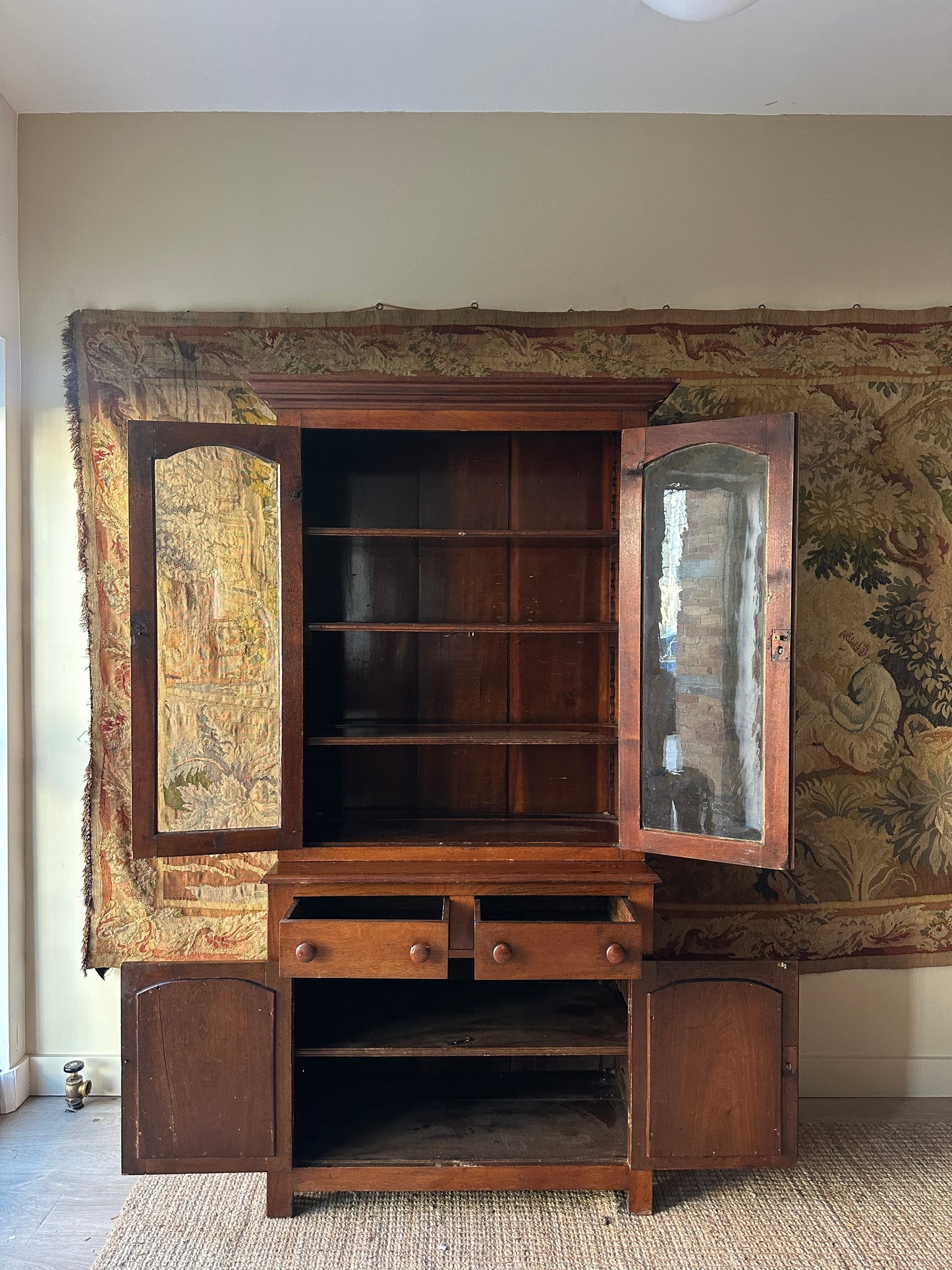 Two piece walnut step back cupboard