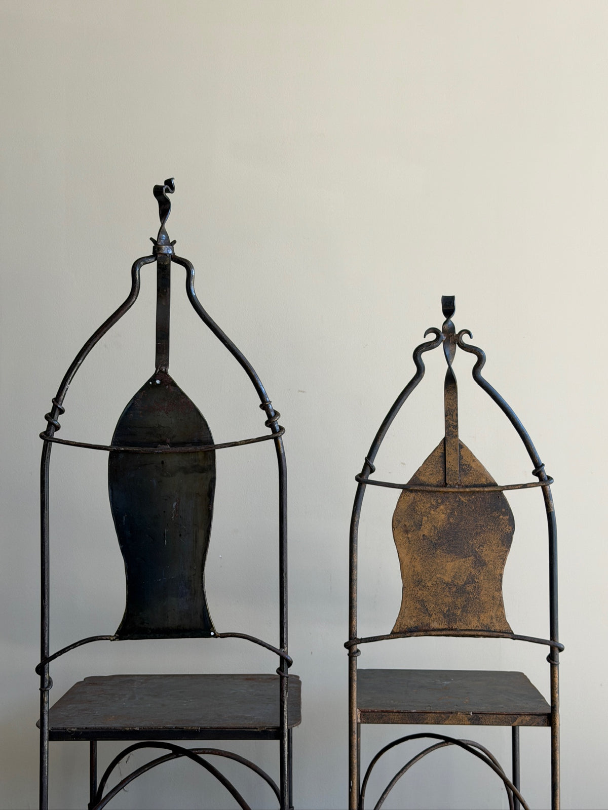Wrought iron sculptural chairs (right)