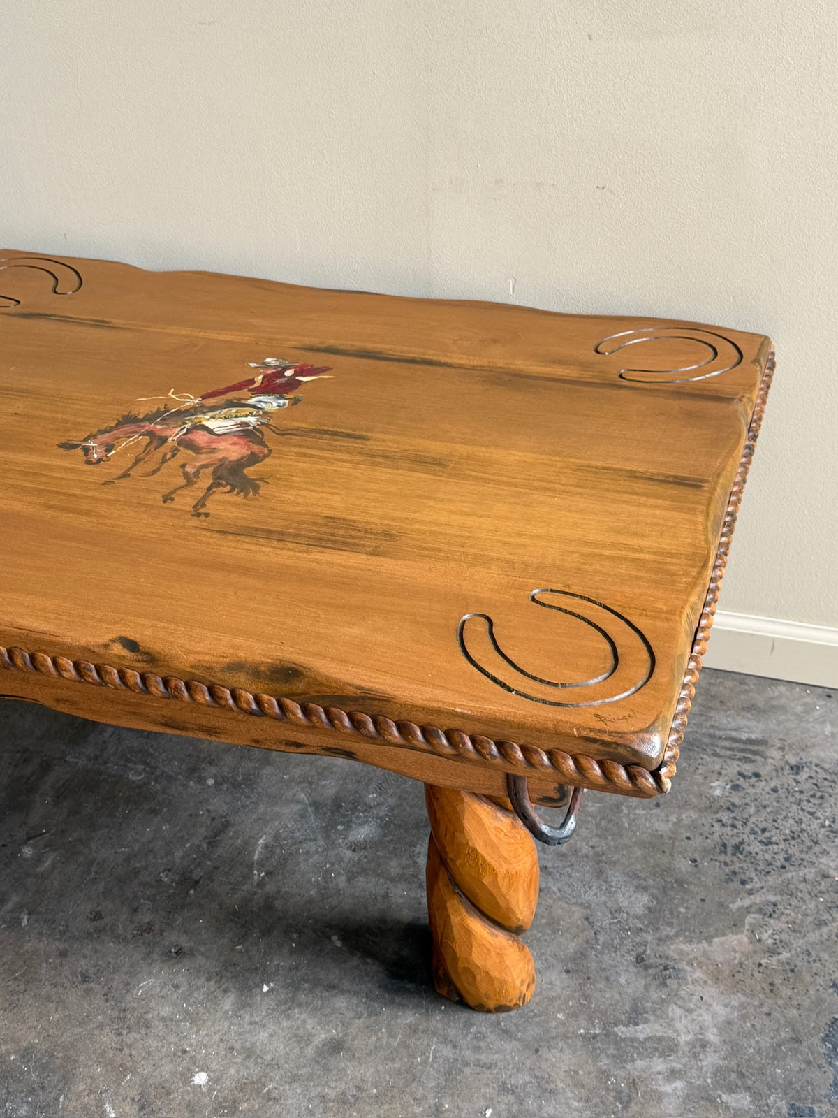 Pine coffee table with equestrian motifs