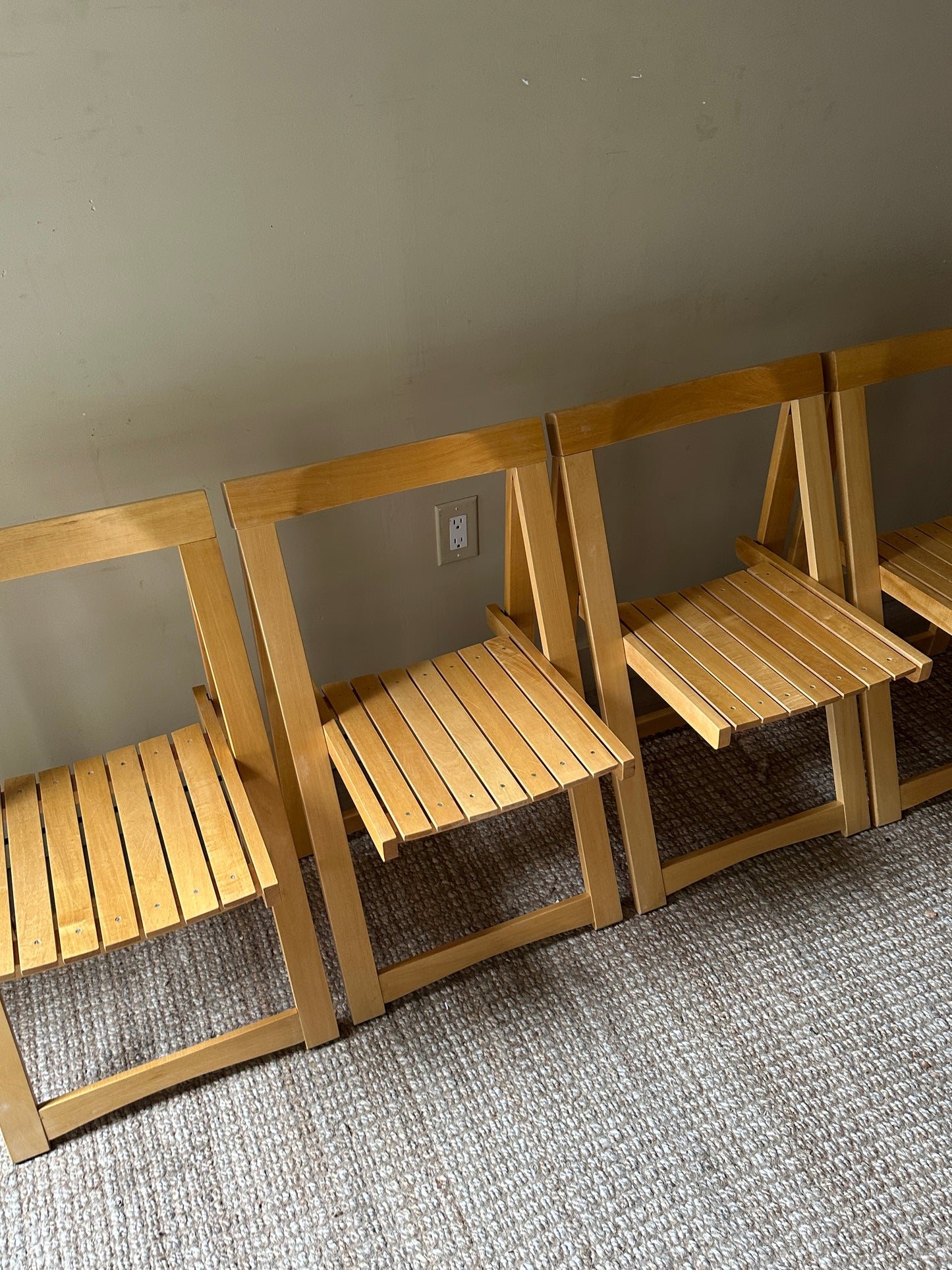 Oak folding chairs. Sold in pairs.