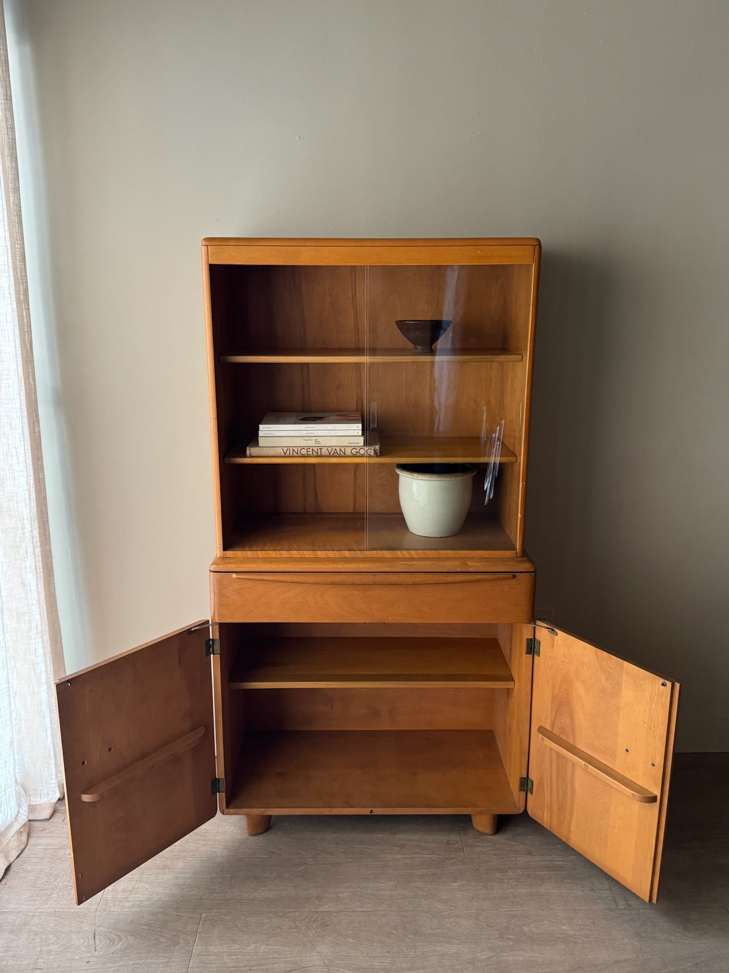 Heywood Wakefield maple two piece display cabinet