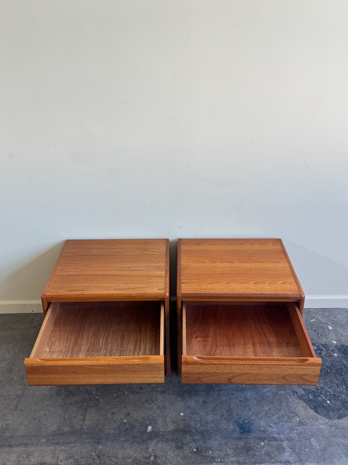 Danish teak nightstands. Sold as a pair.