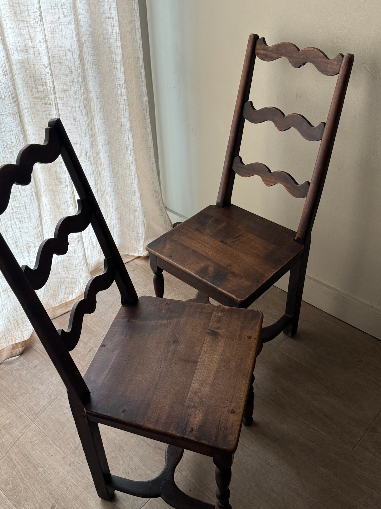 French oak ladder back dining chairs. Sold as a pair.
