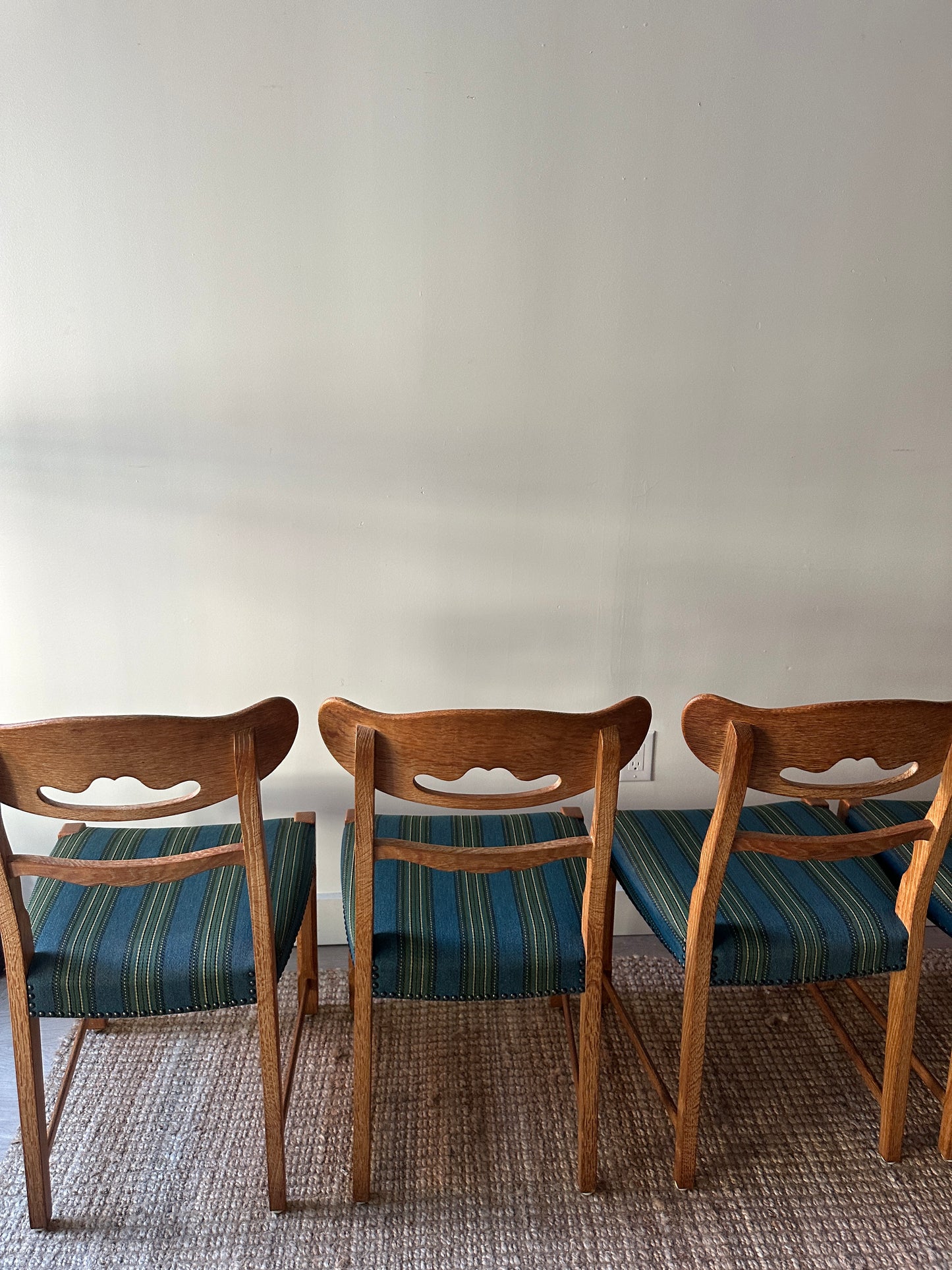 White oak wool and wool dining chairs sold in sets of 2