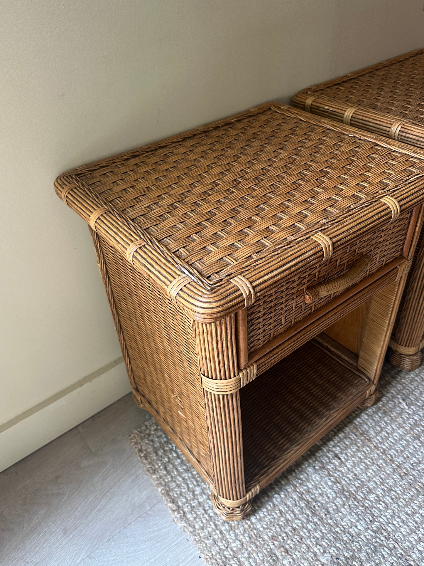 Wicker bedside tables. Sold individually.