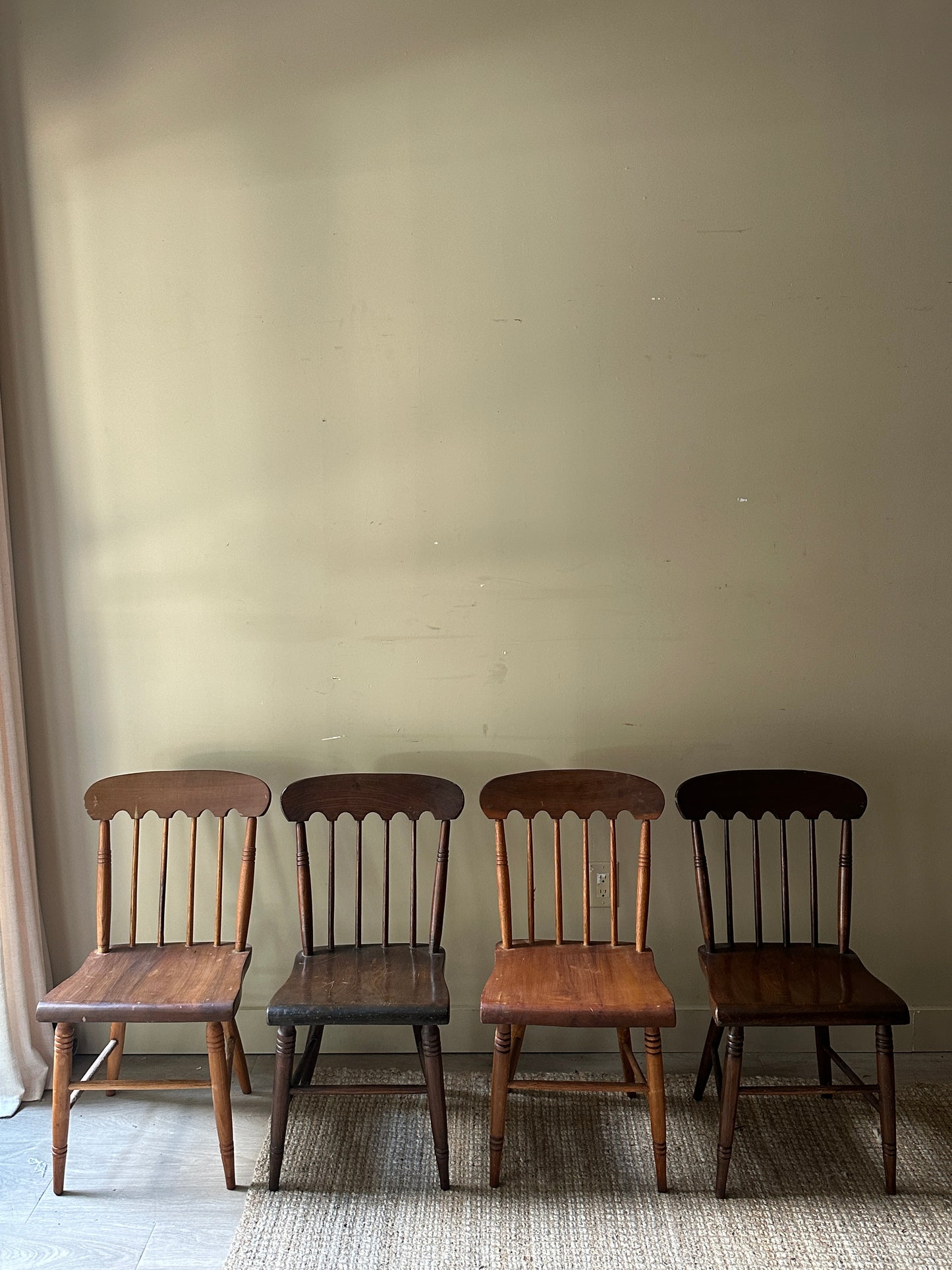 Scalloped mixed wood dining chairs. Sold in pairs.