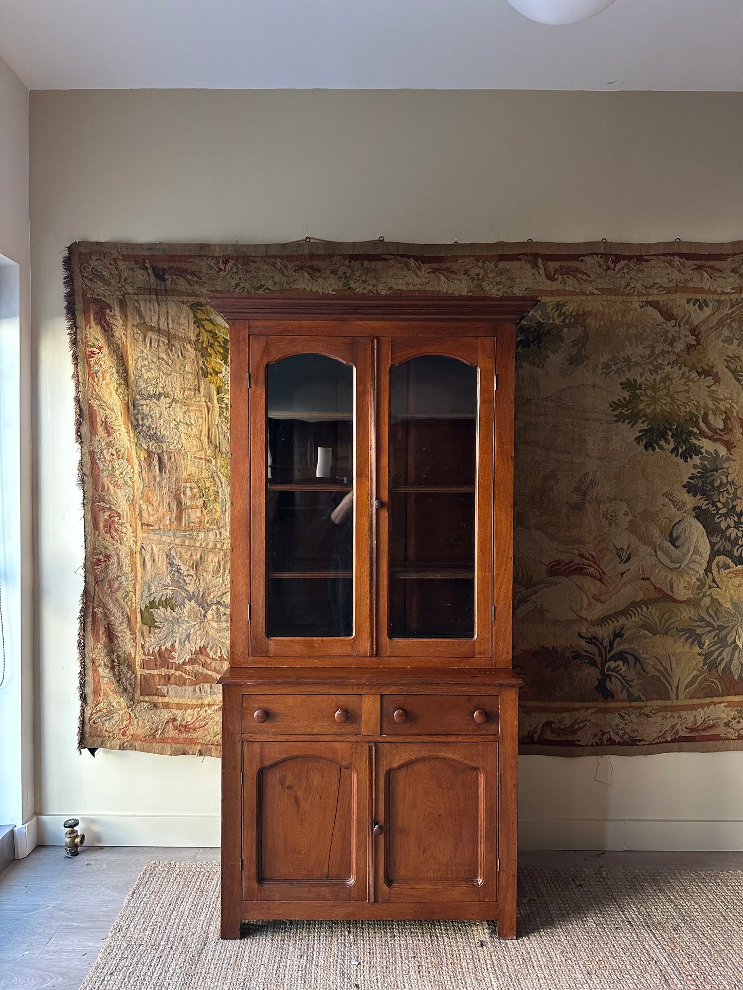 Two piece walnut step back cupboard