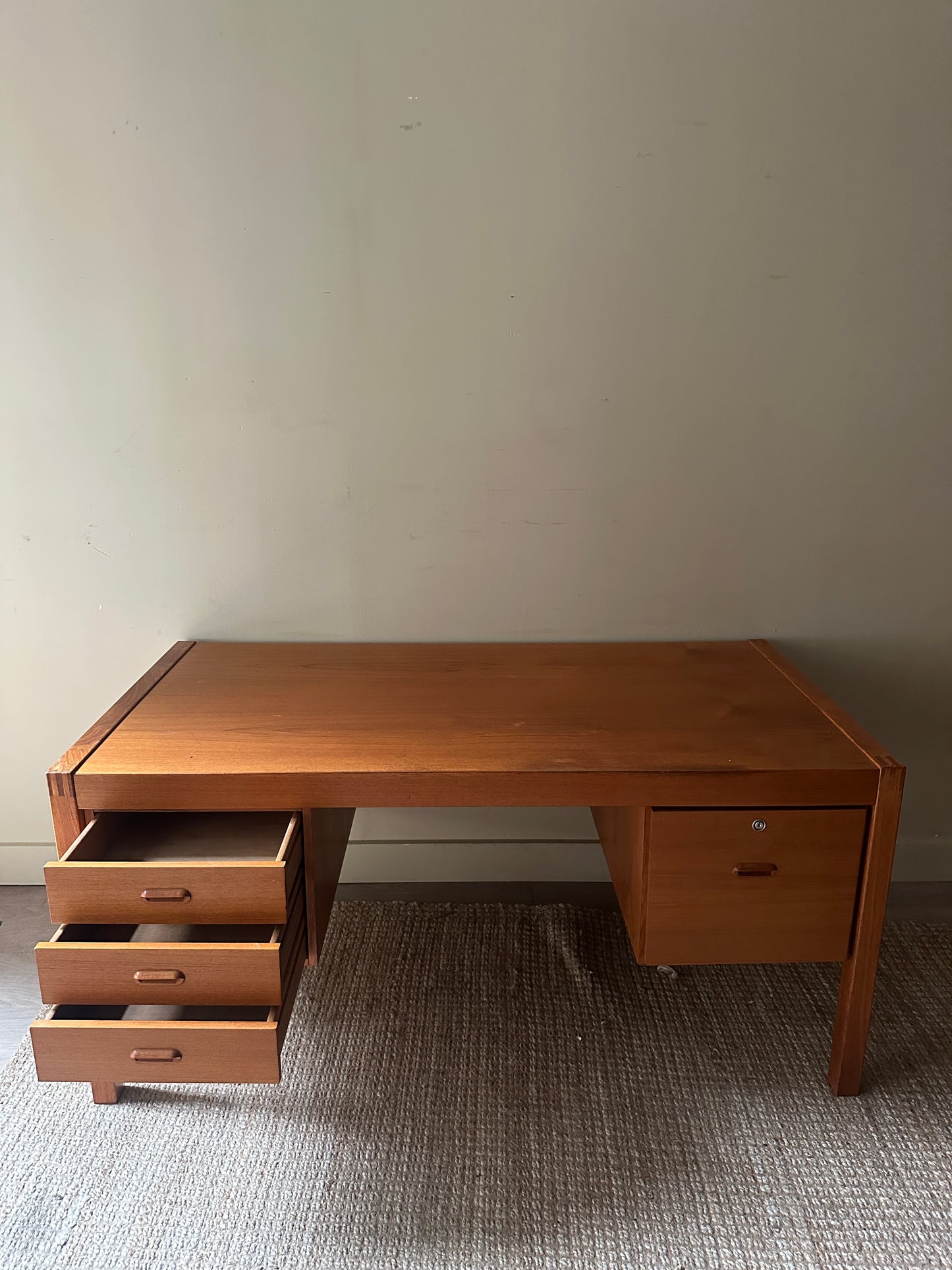 Teak desk. Right drawer locked.