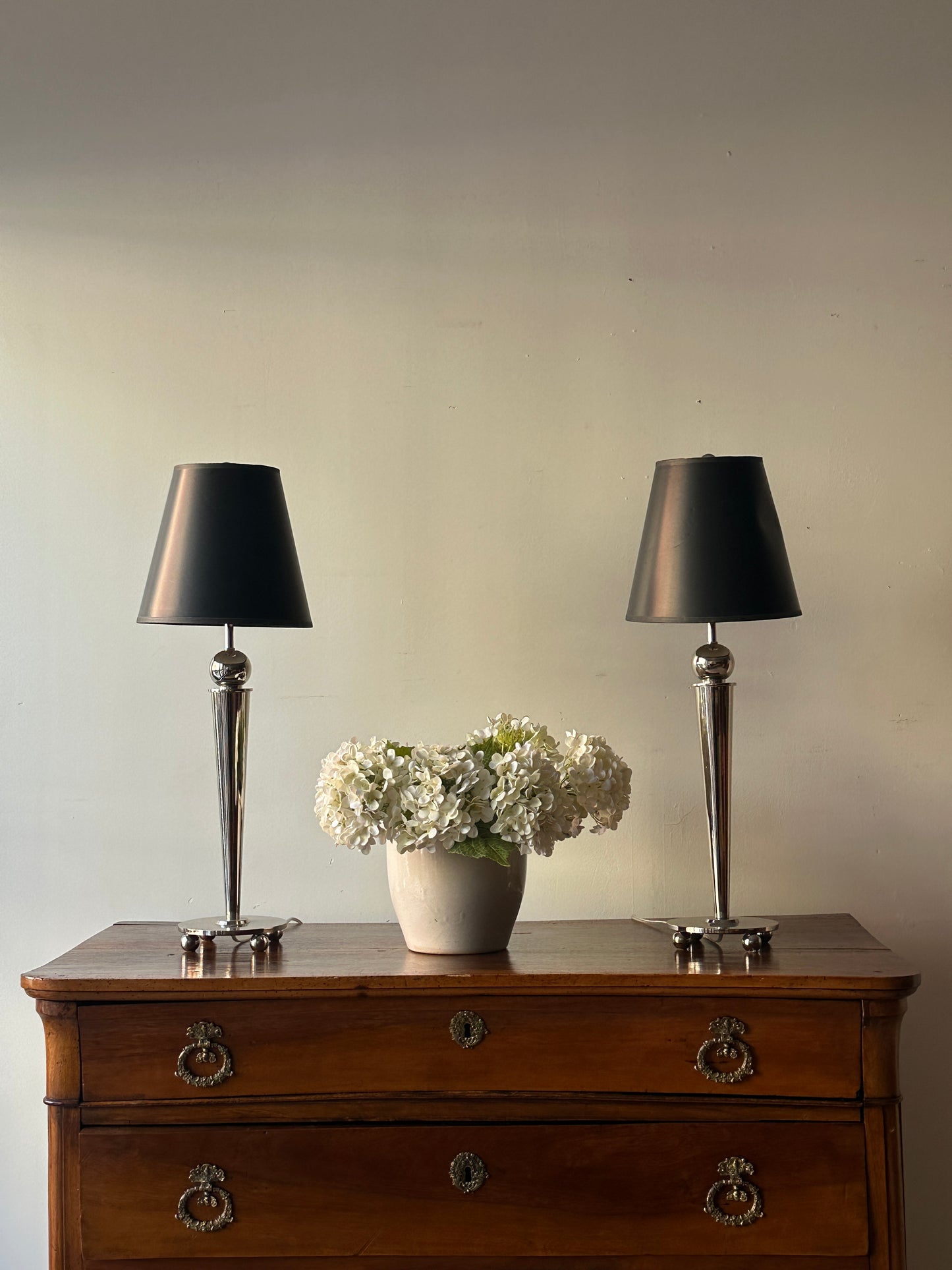 Pair of chrome, ball foot lamps.