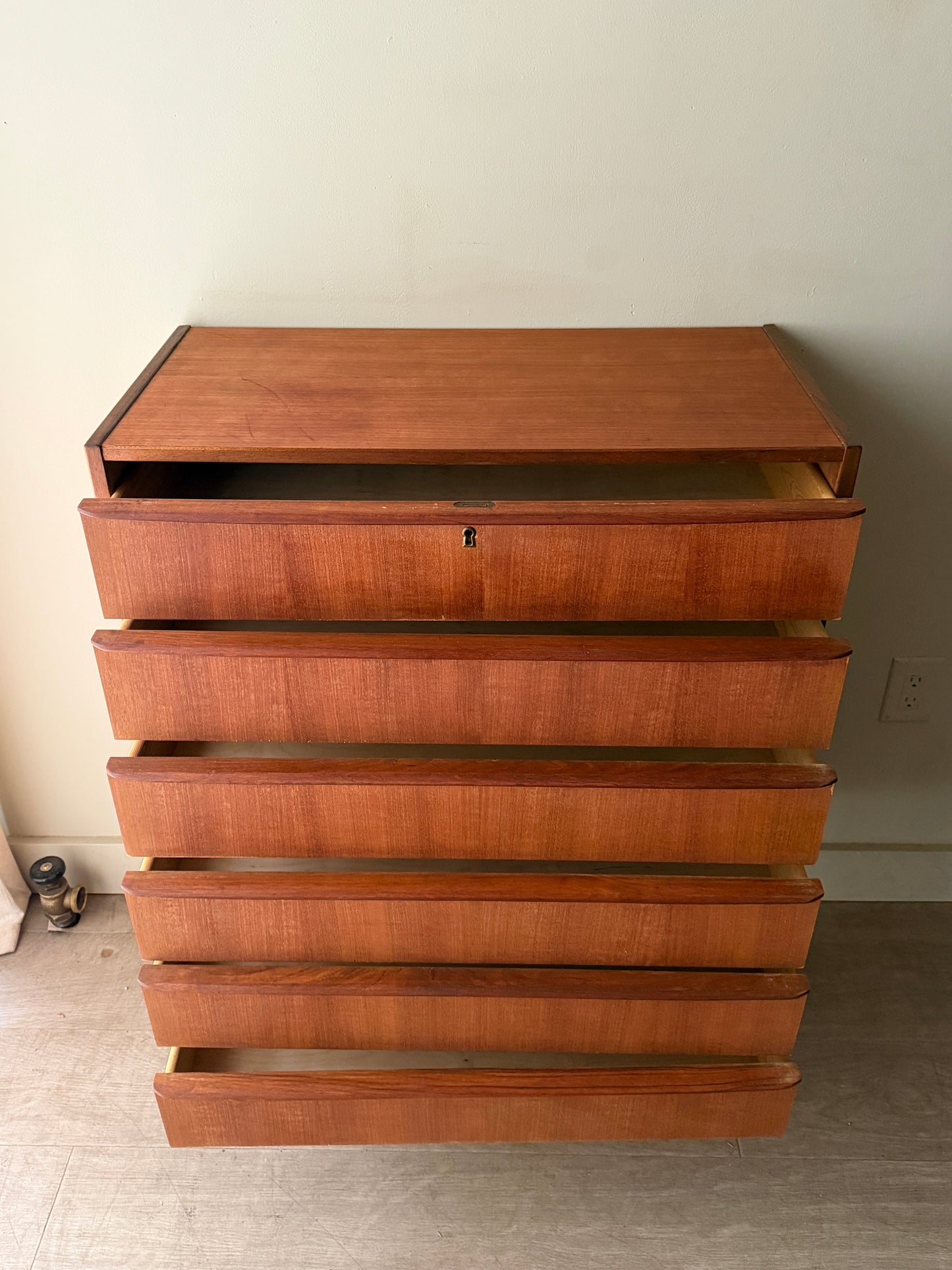 Danish teak tallboy dresser (left)