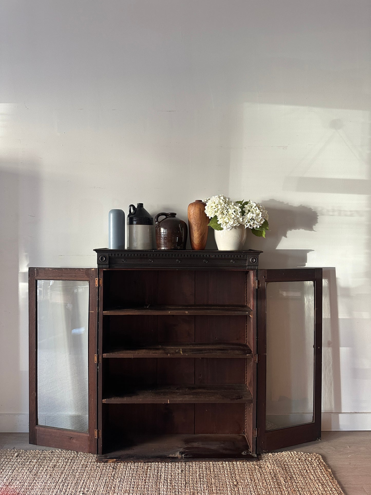 Carved mahogany display case