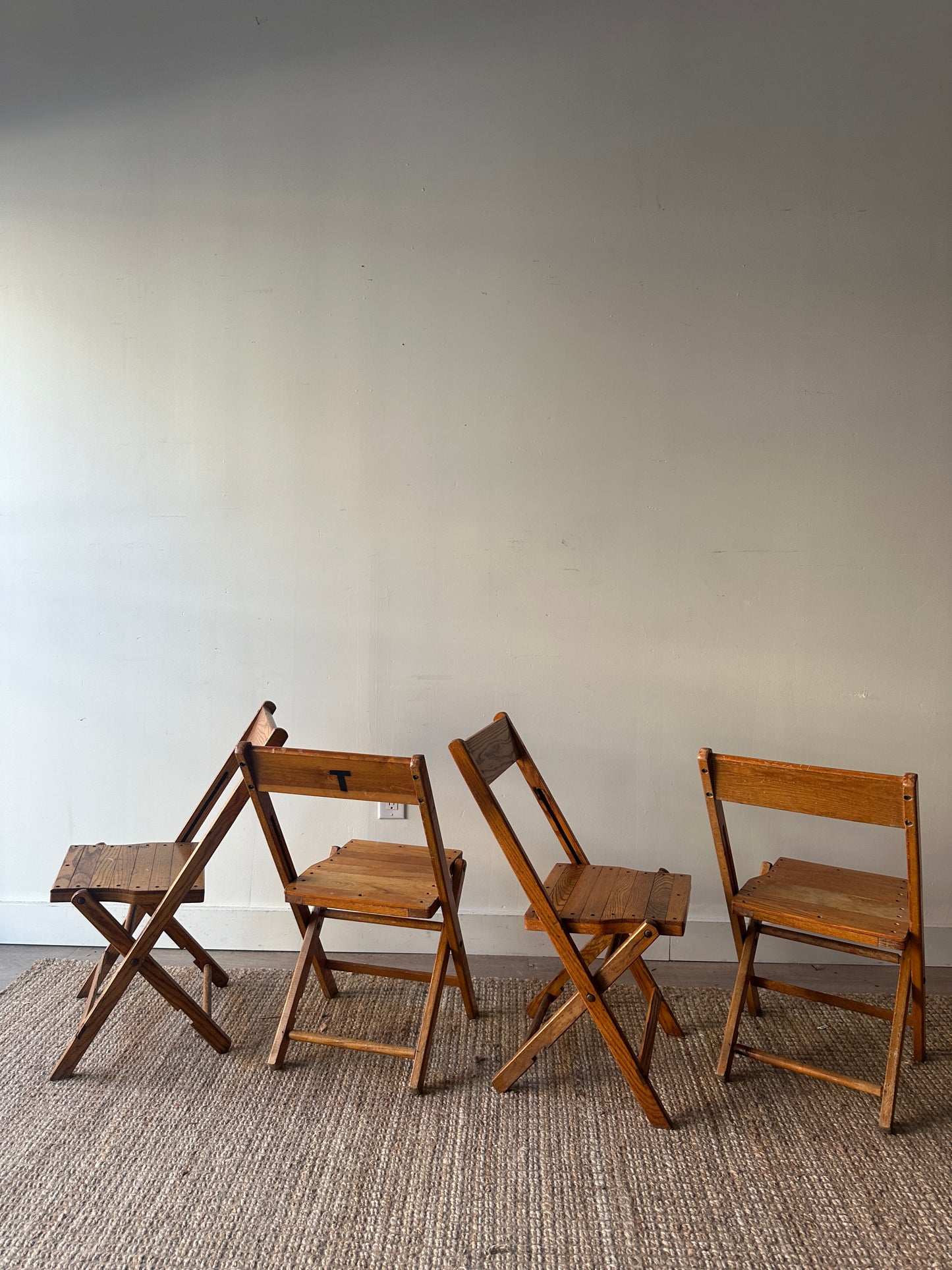4 oak folding chairs. Sold individually.