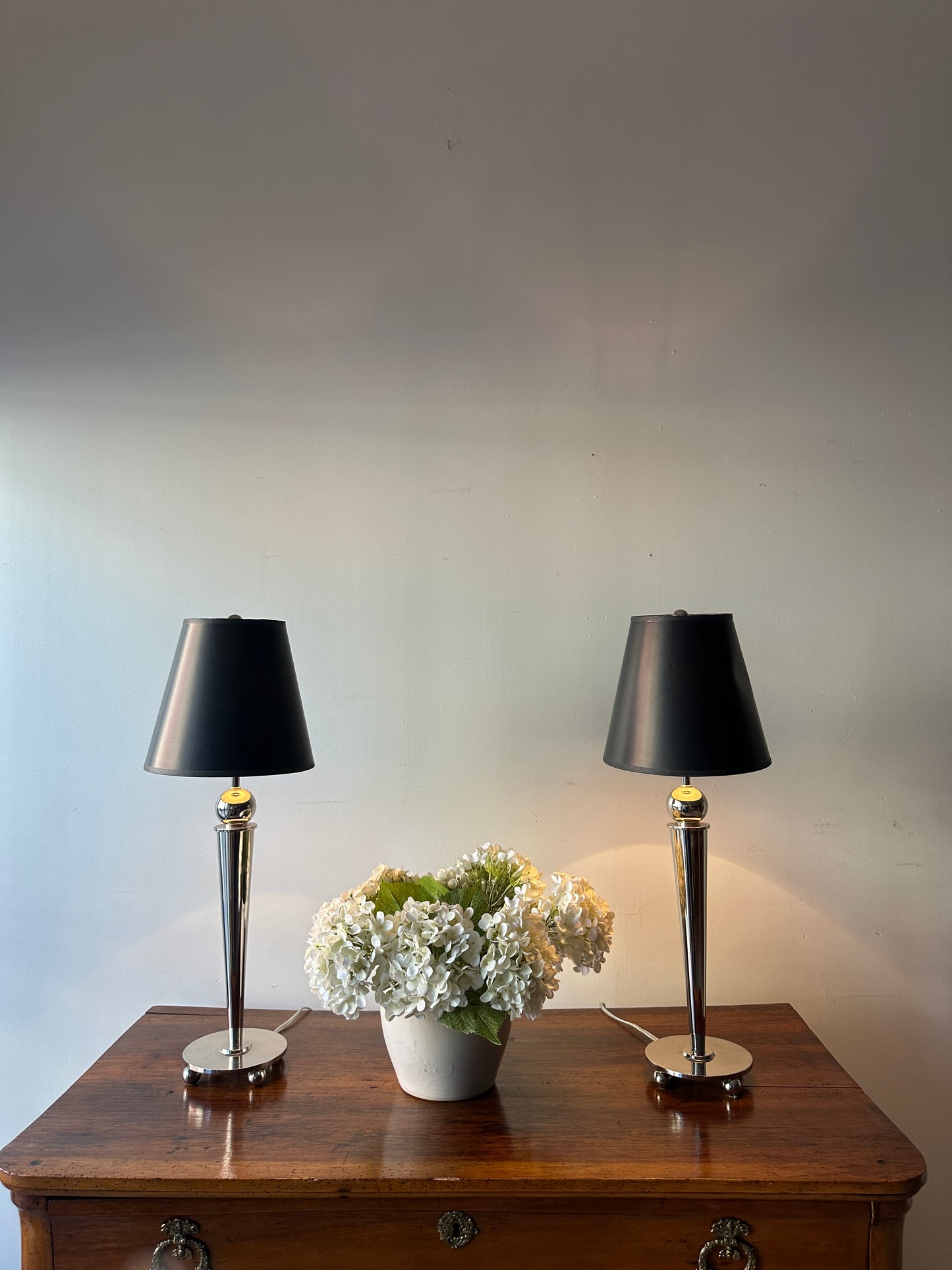 Pair of chrome, ball foot lamps.