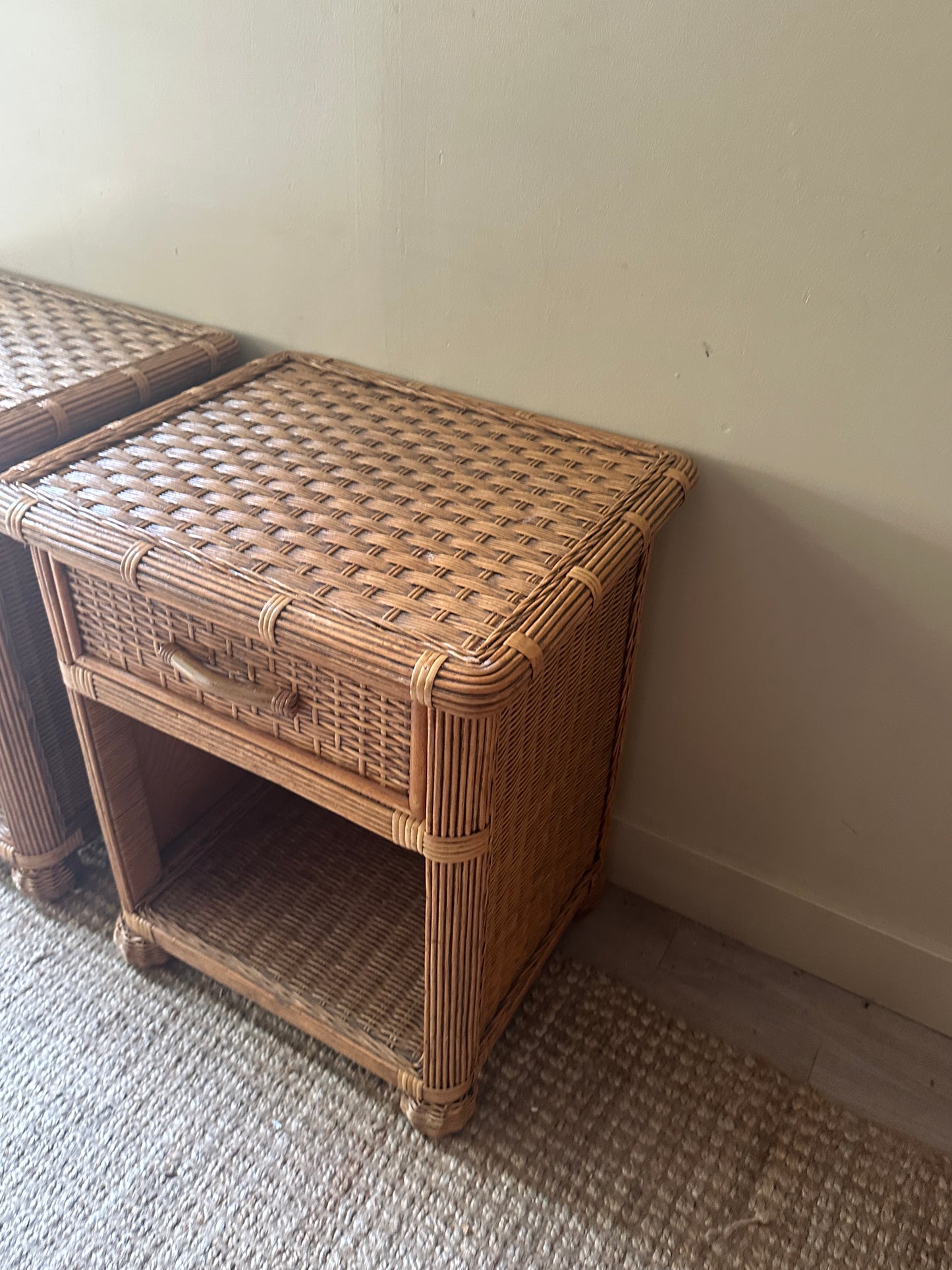 Wicker bedside tables. Sold individually.