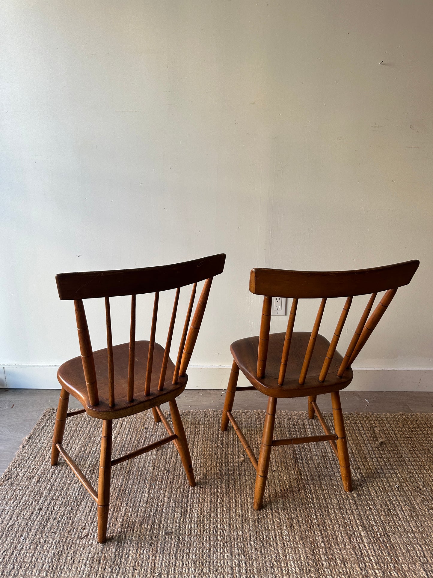 Pair of plank seat chairs. Sold together.