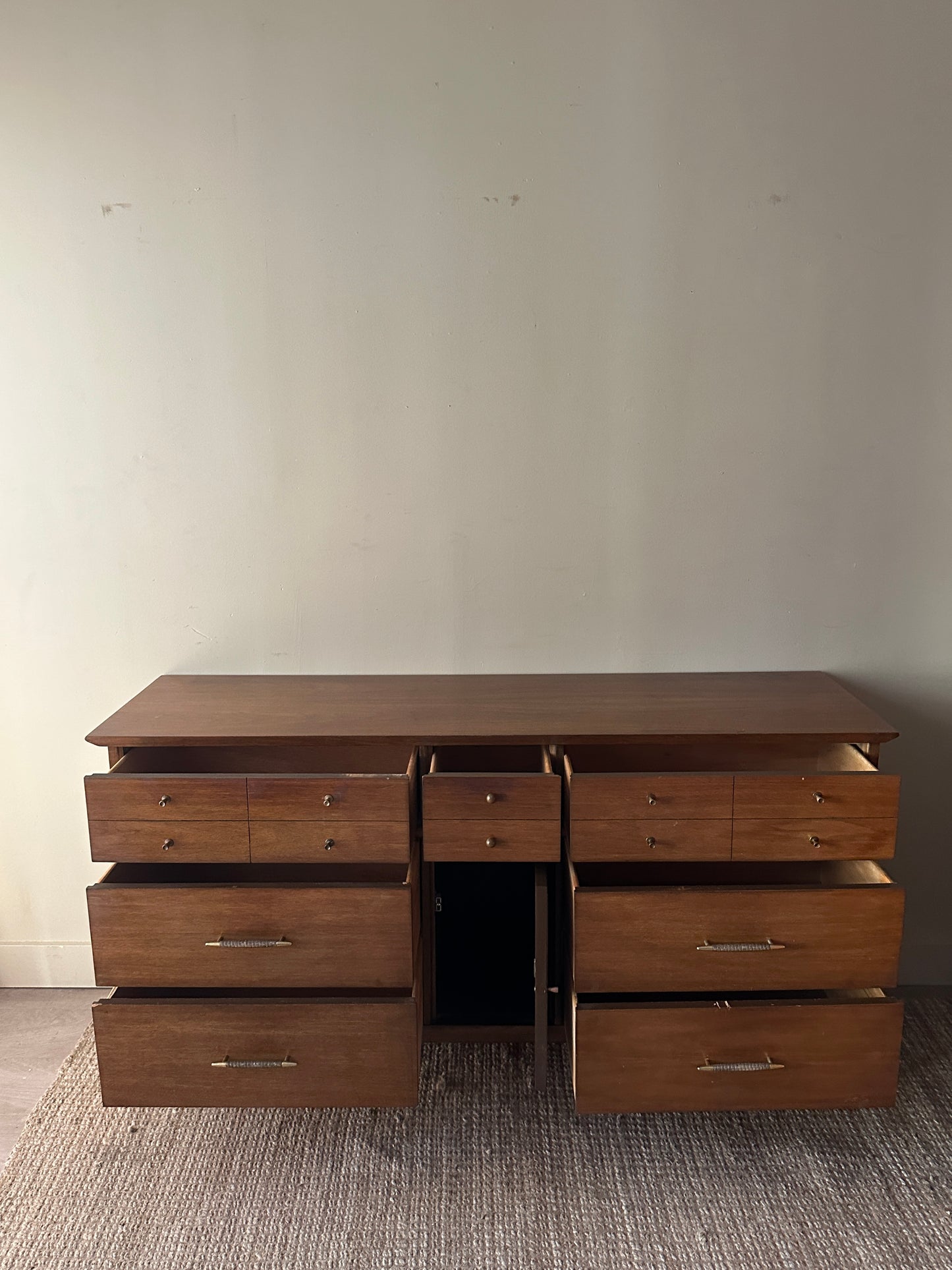 Walnut credenza with rattan door