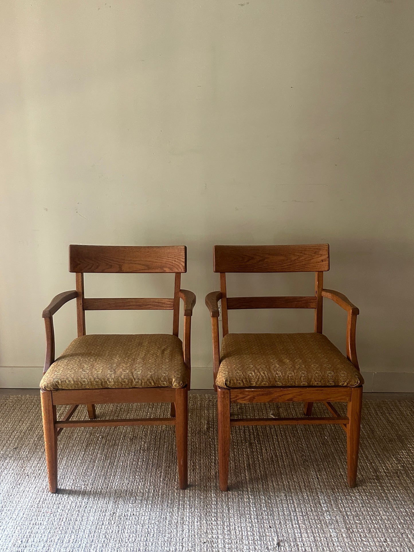Oak arm chairs. Sold individually.