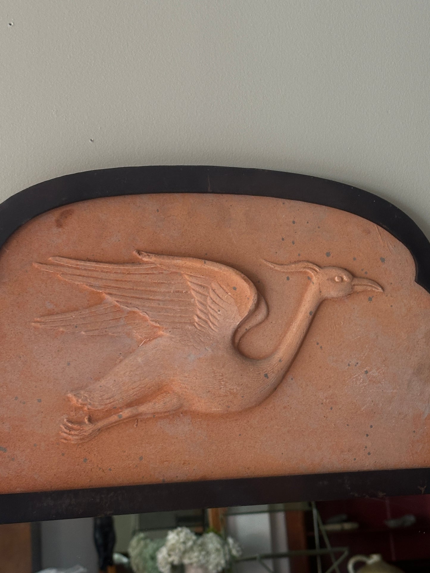 Metal and terracotta heron mirror