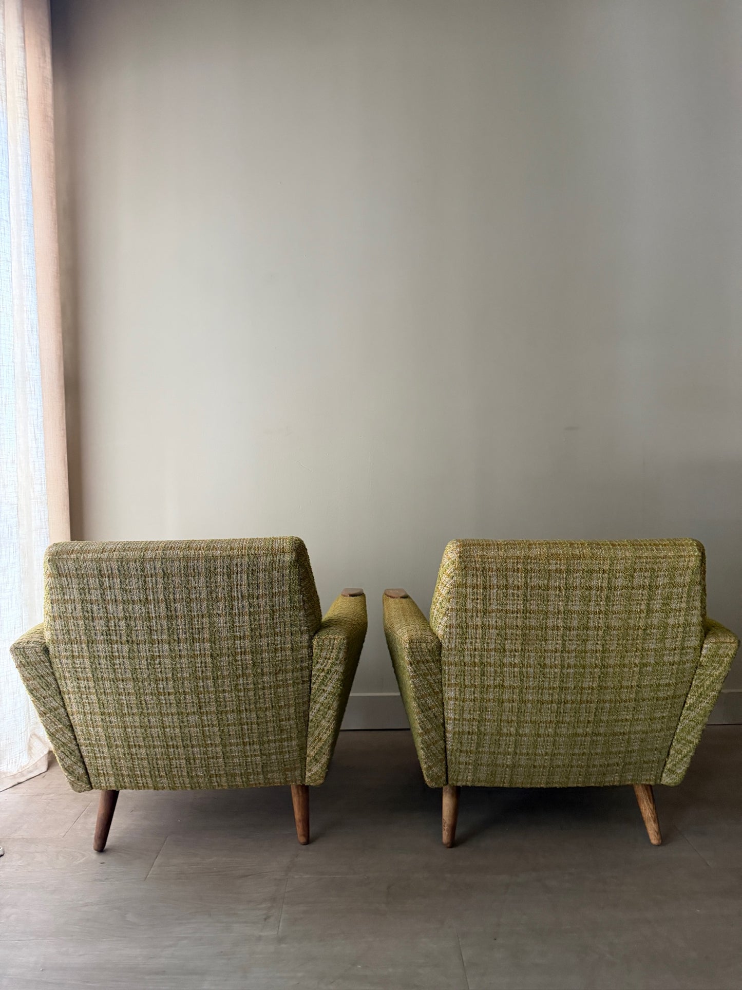 Green plaid Danish lounge chairs. Sold individually.