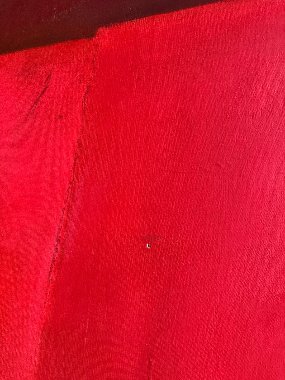 Large red abstract. Signed “Caycedo.”