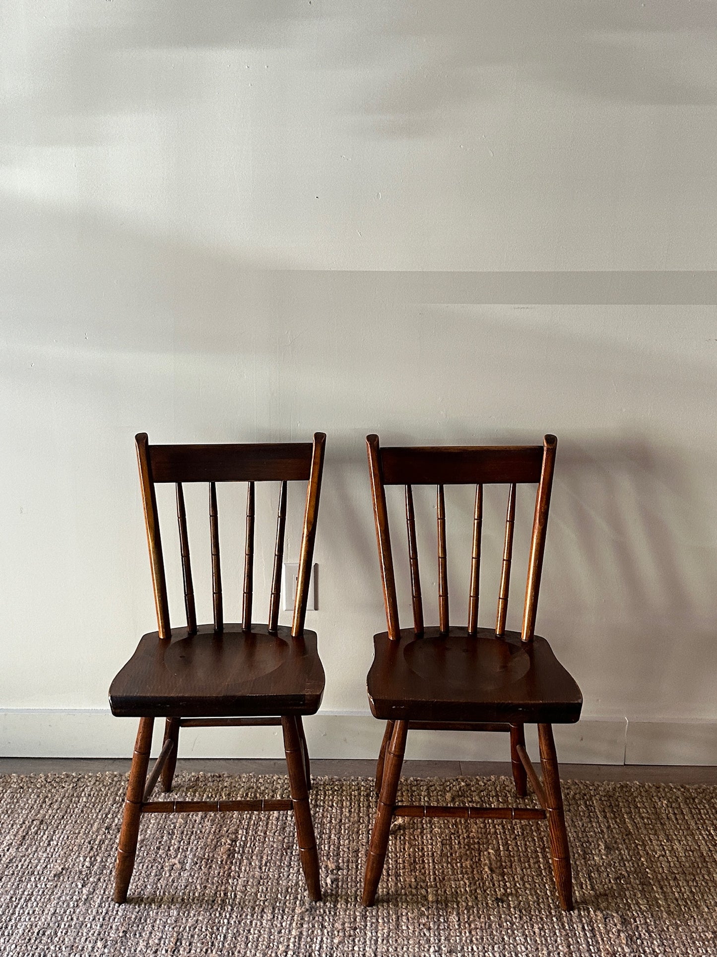 Pair of carved plank seat chairs