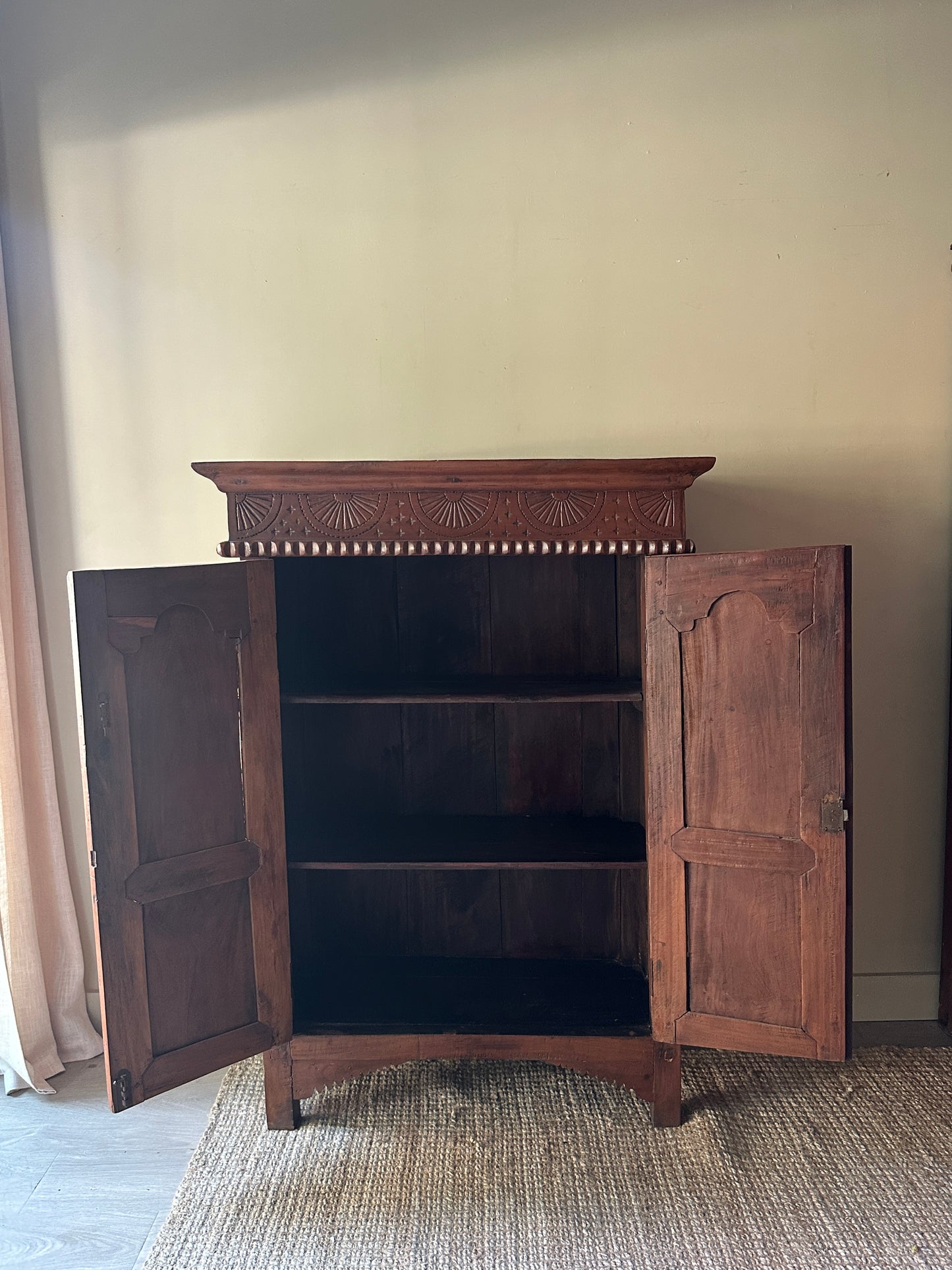 Carved pine cabinet