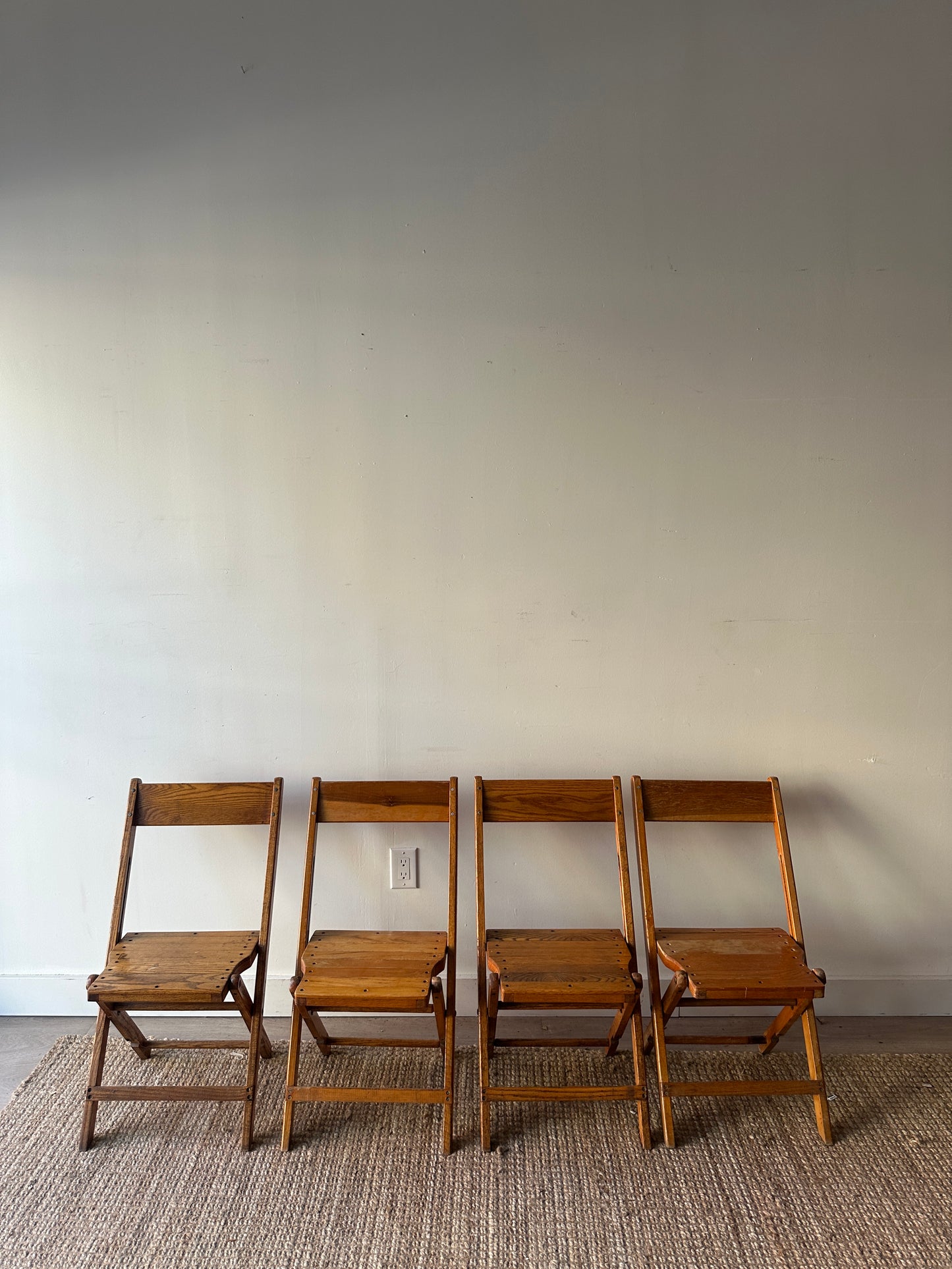 4 oak folding chairs. Sold individually.