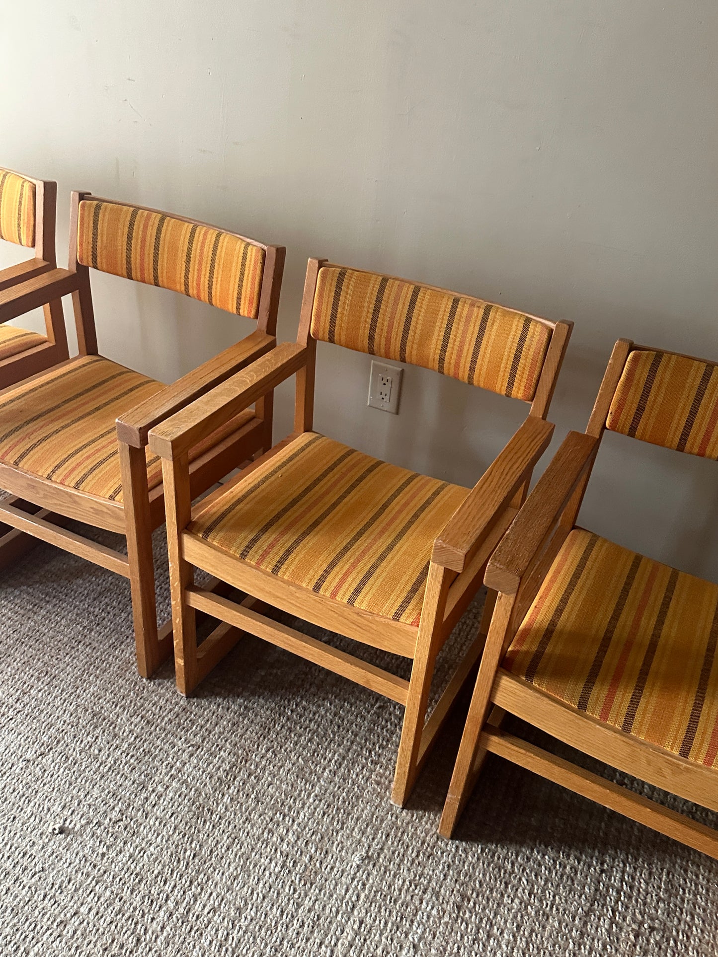 Oak armchairs. Sold individually.