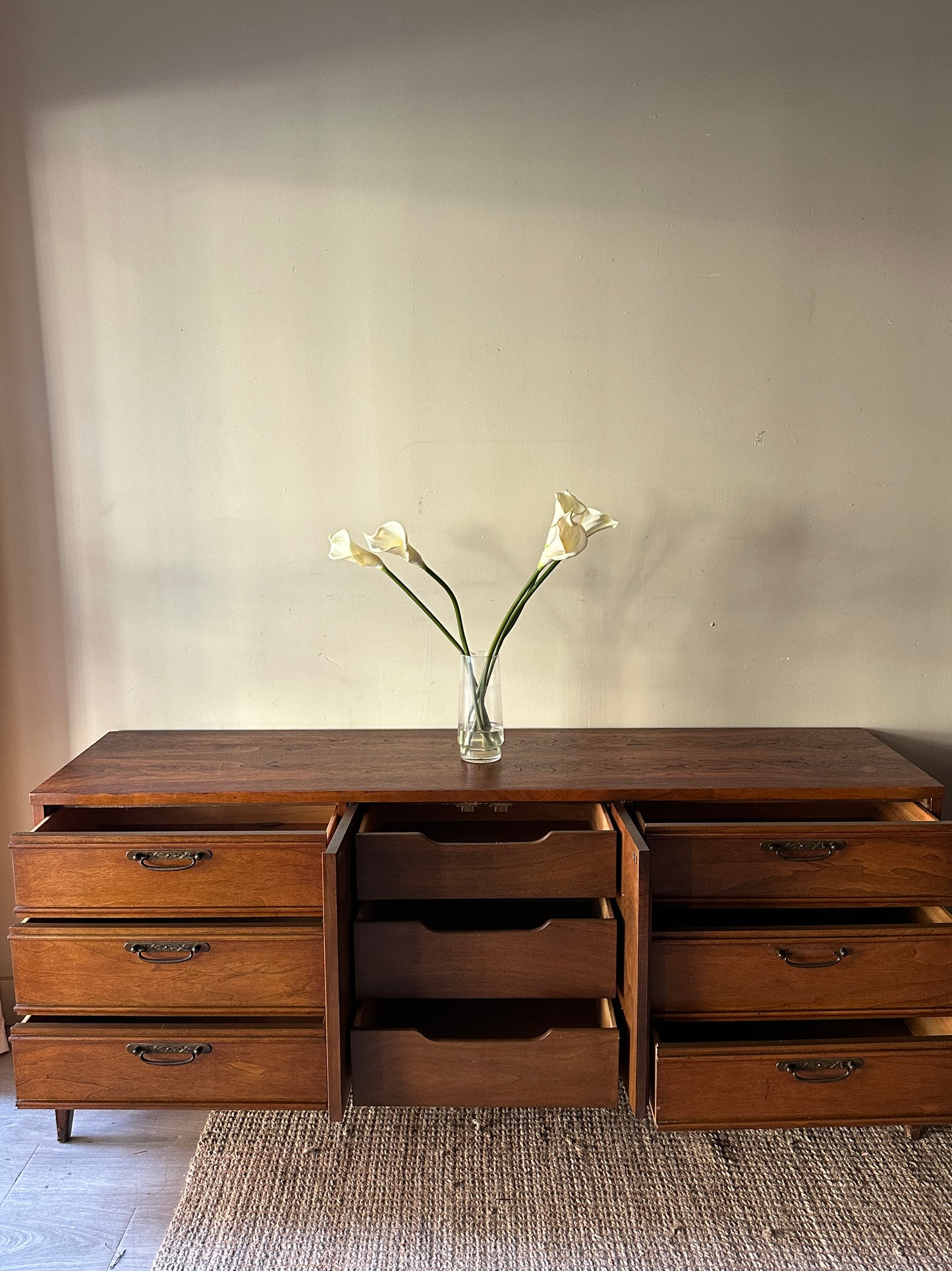Walnut credenza with carved center handles