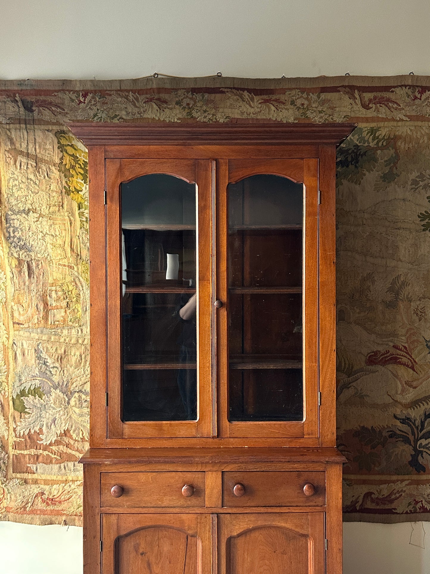 Two piece walnut step back cupboard