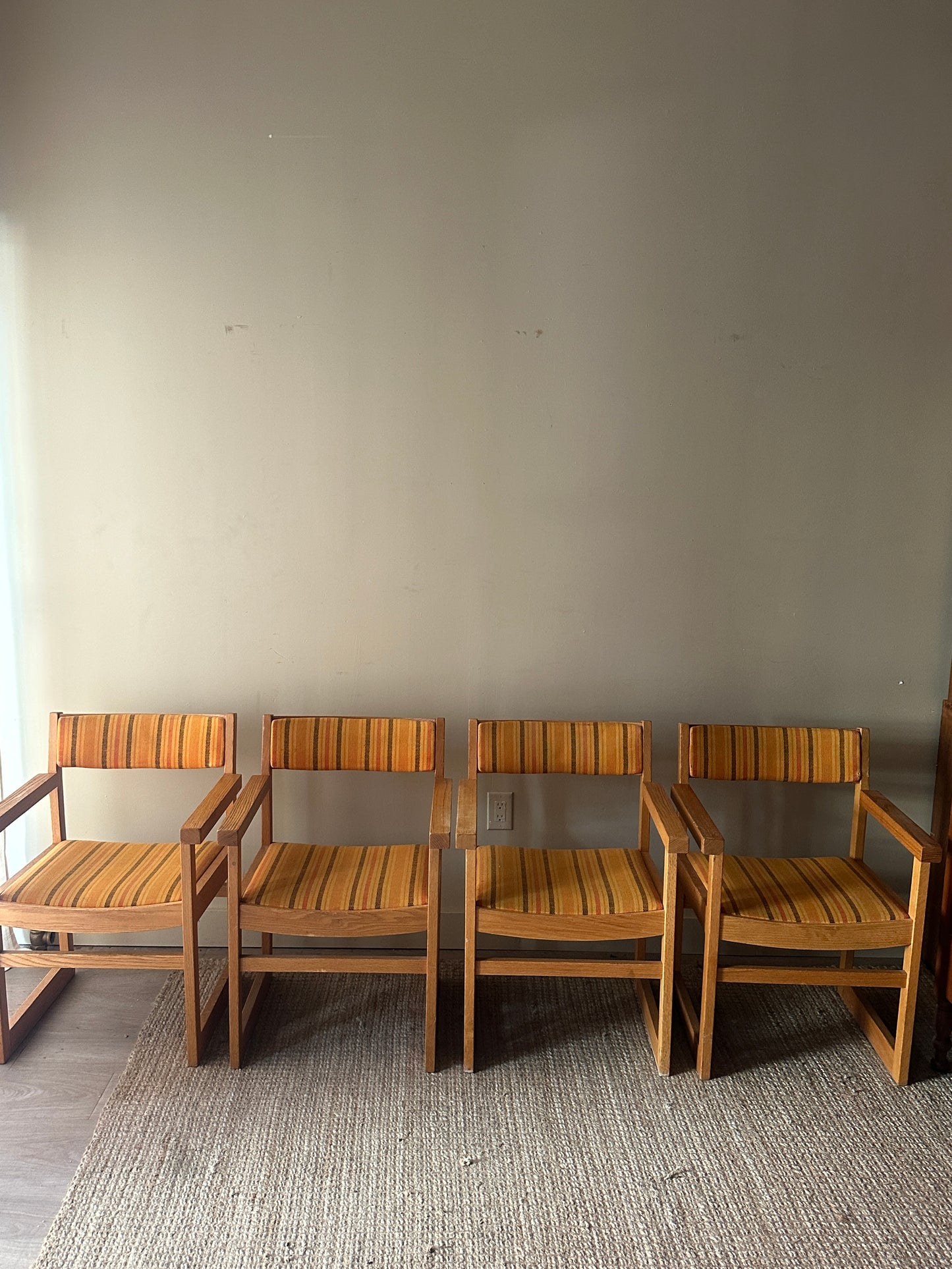 Oak armchairs. Sold individually.